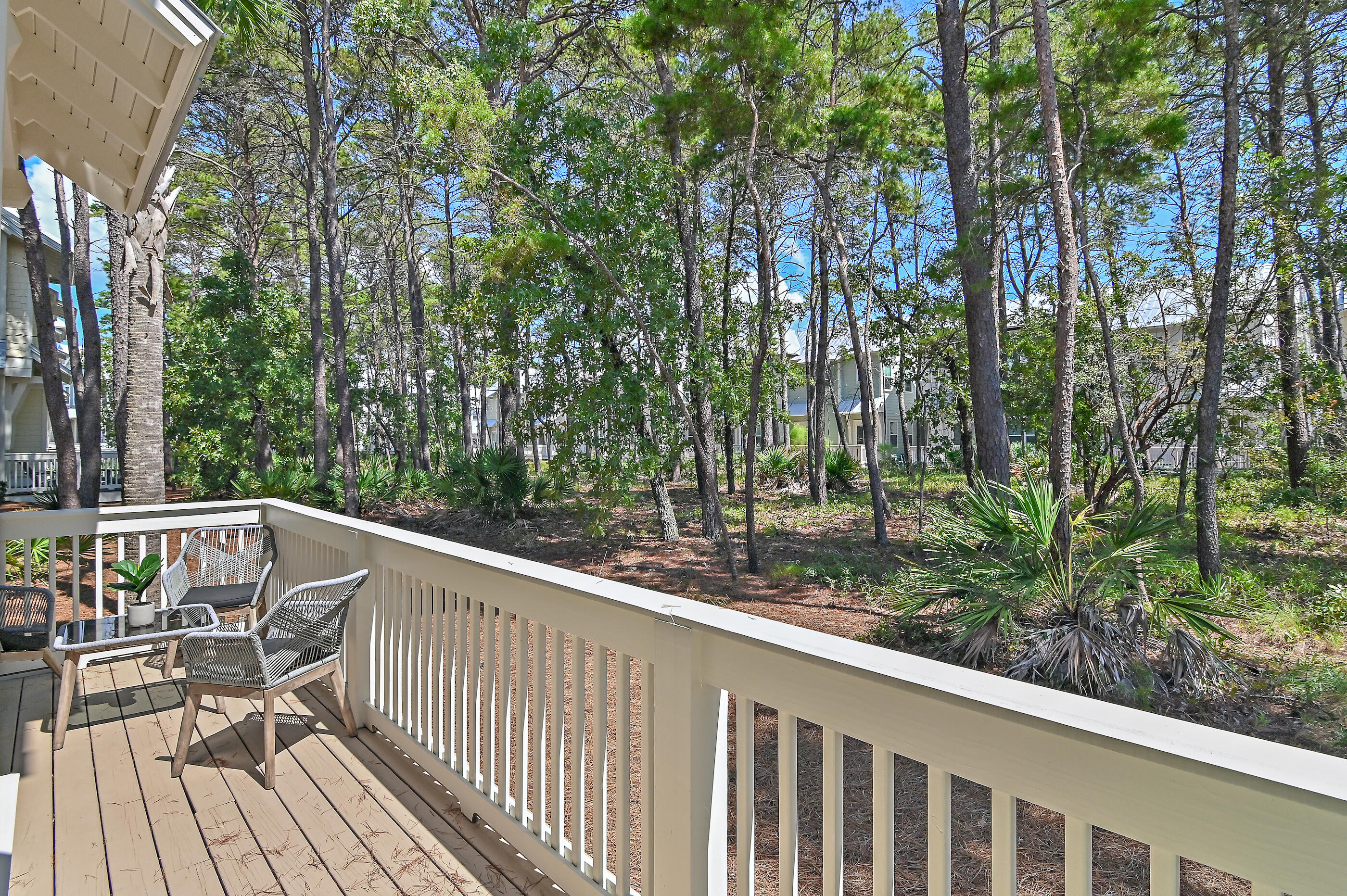 64 West W Pine, Unit A Inlet Beach, FL 32461 - Photo 6 of 61 a view of backyard with deck and outdoor seating