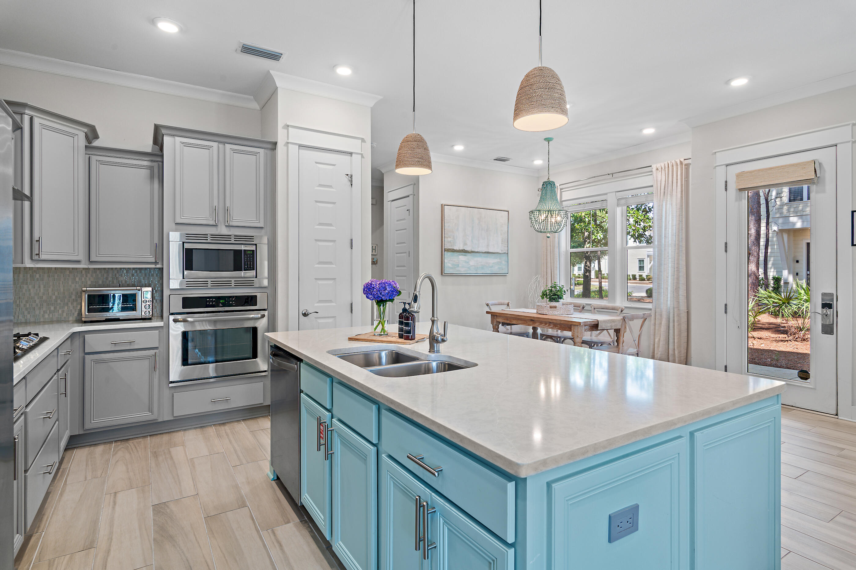 64 West W Pine, Unit A Inlet Beach, FL 32461 - Photo 10 of 61 a kitchen with stainless steel appliances granite countertop a sink refrigerator and cabinets