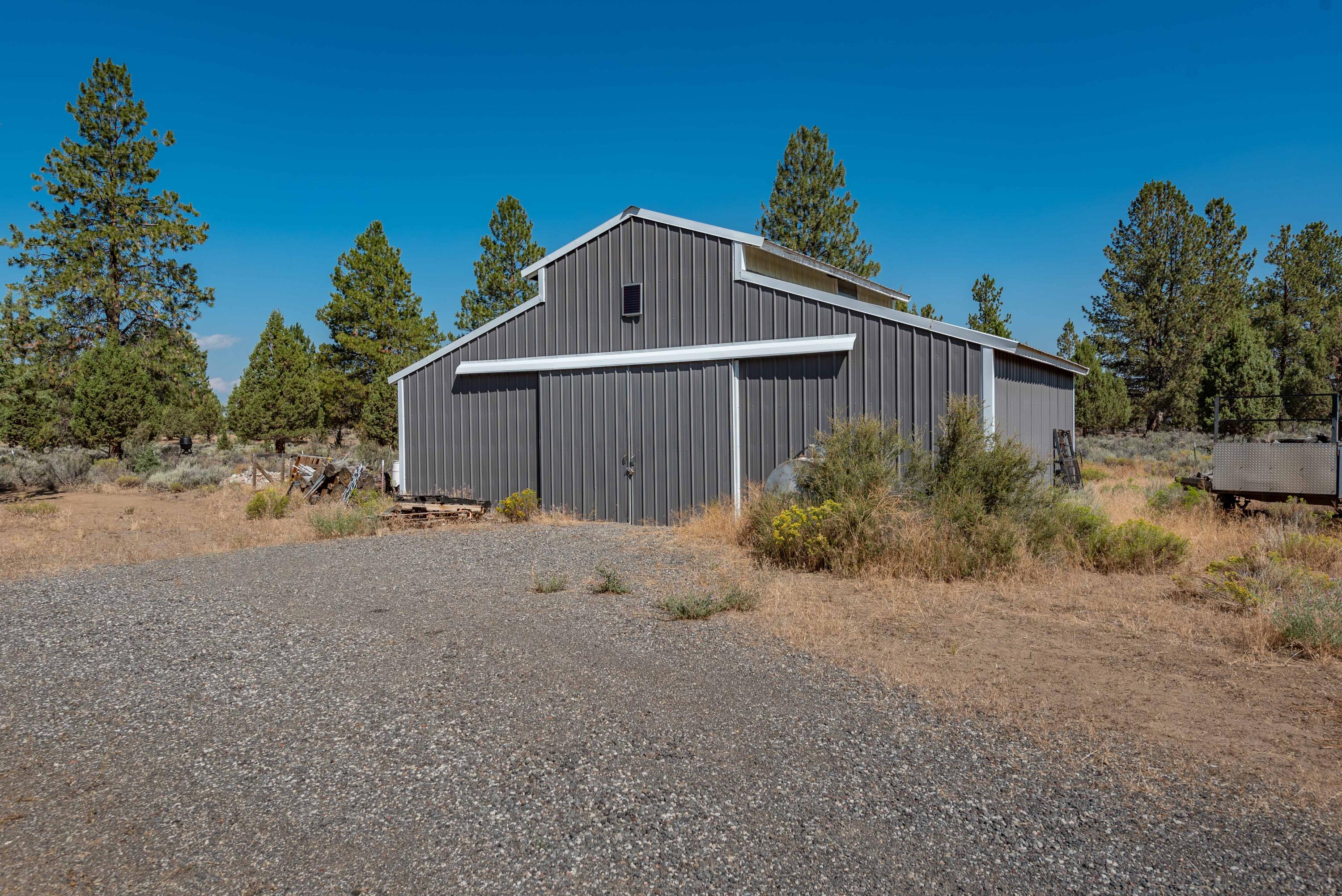 21698 Rickard Road Bend, OR 97702 - Photo 13 of 51 Barn with sliding doors. Approx 24x36 according to Deschutes County records.