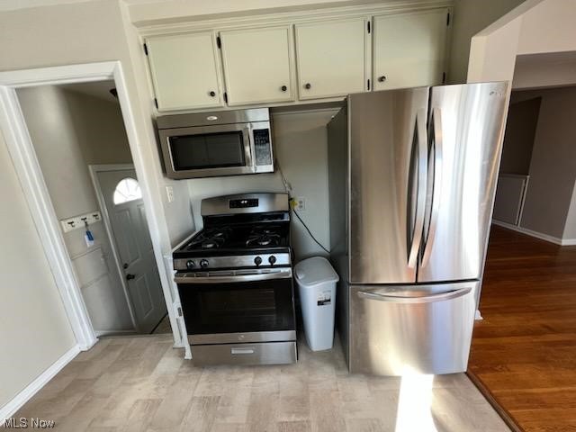 30028 Warren Road Wickliffe, OH 44092 - Photo 3 of 19 Kitchen with appliances with stainless steel finishes and light hardwood / wood-style flooring