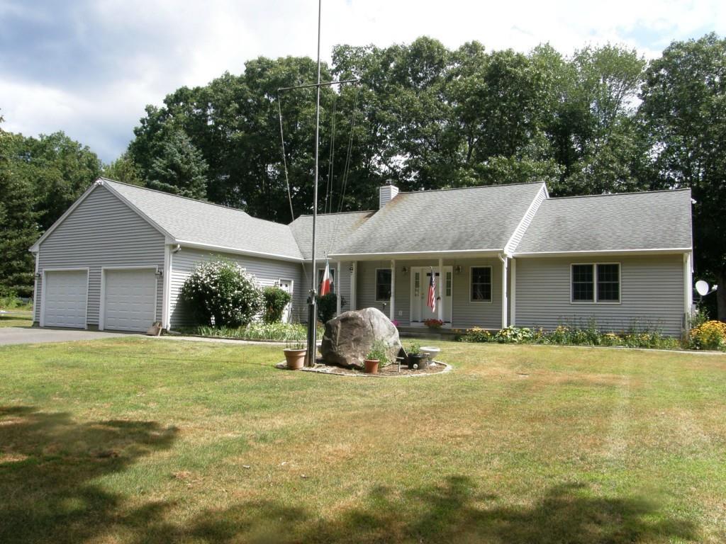 42 Cedar Swamp Road Mansfield, CT 06268 - Photo 1 of 1 a front view of a house with a yard and trees