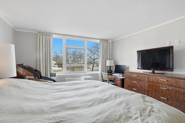 a view of a livingroom with furniture and a flat screen tv