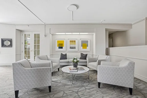 a living room with furniture and a table