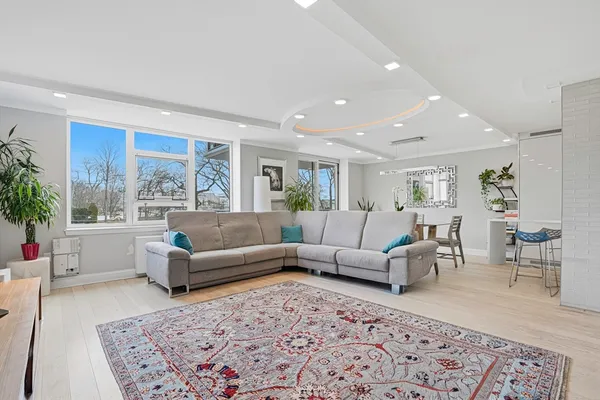 a living room with furniture and a rug