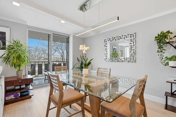 a dining room with furniture and window