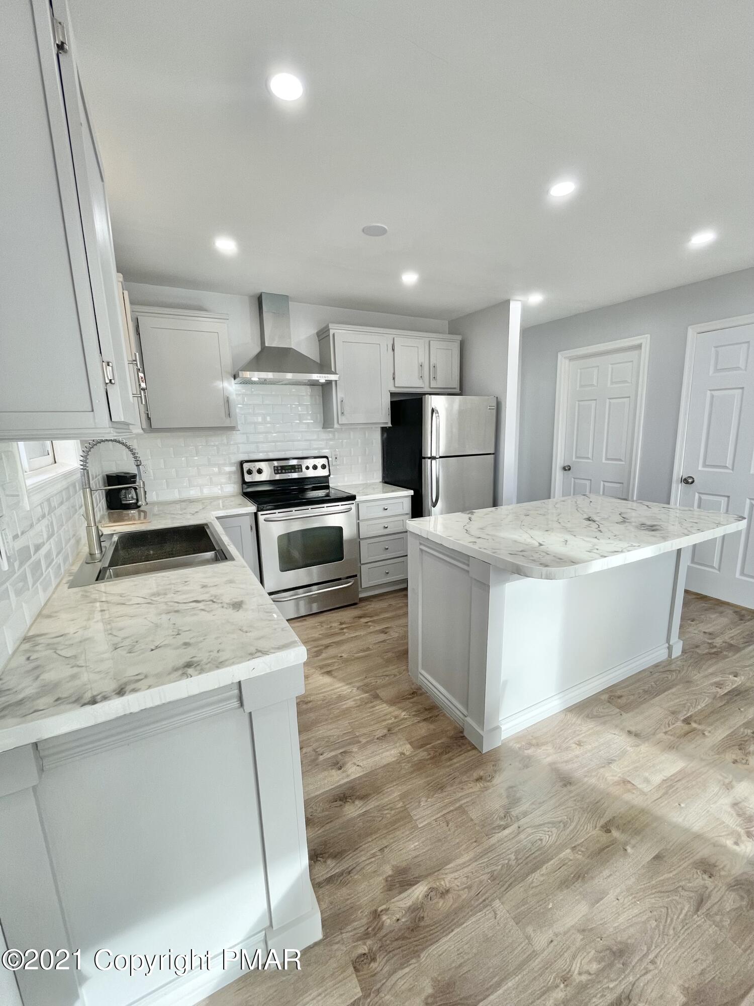 128 Ashley Court Bushkill, PA 18324 - Photo 36 of 87 Kitchen Bedroom + Basement Dr view