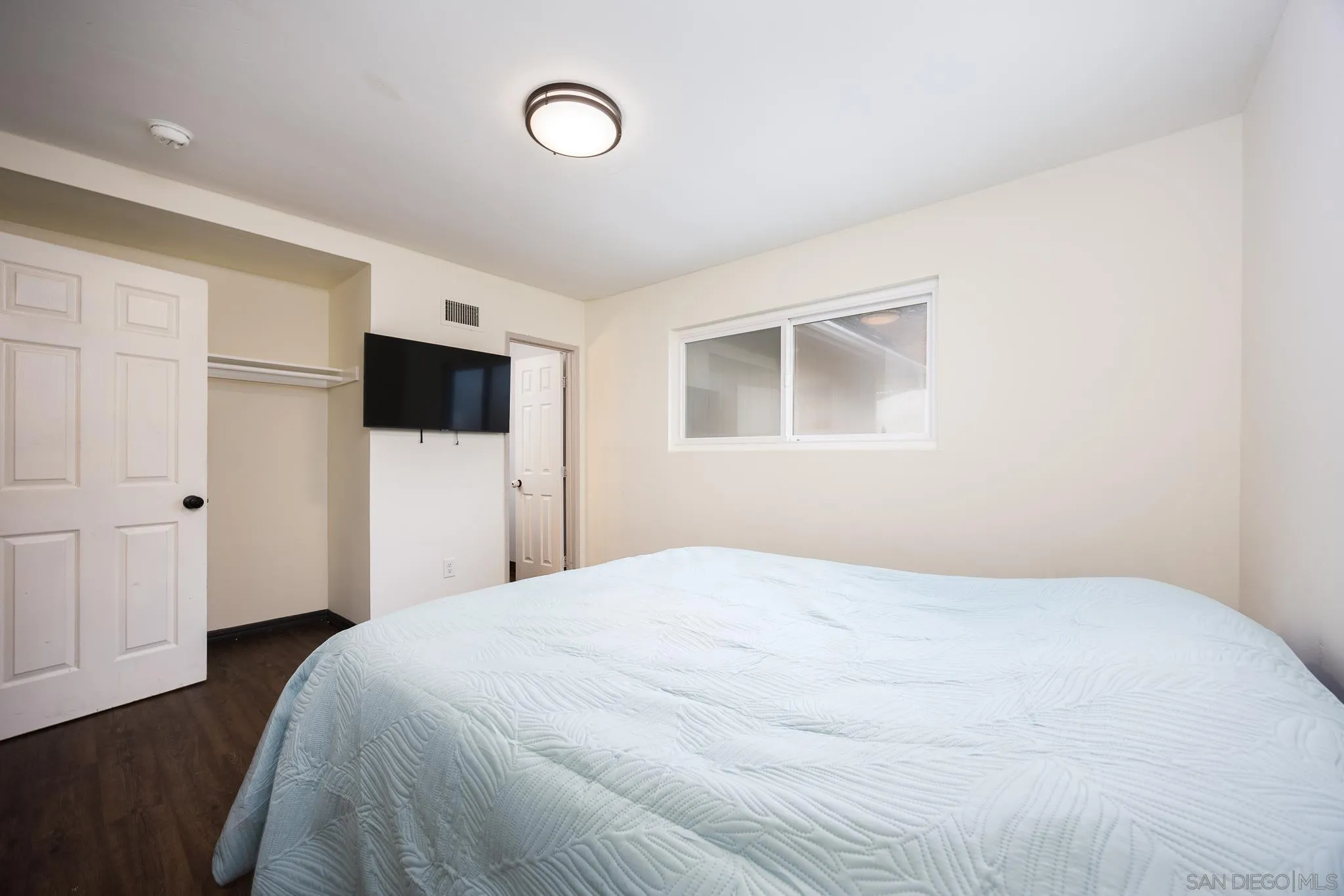 13553 Carriage Road Poway, CA 92064 - Photo 17 of 45 a bedroom with a bed and a television