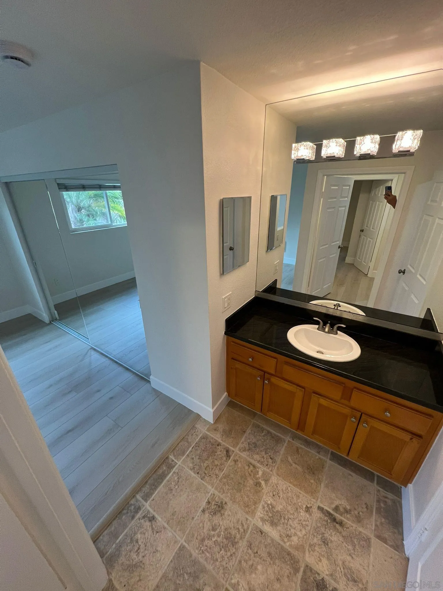 9860 Dale Avenue, Unit D8 Spring Valley, CA 91977 - Photo 11 of 19 a bathroom with a sink and a mirror