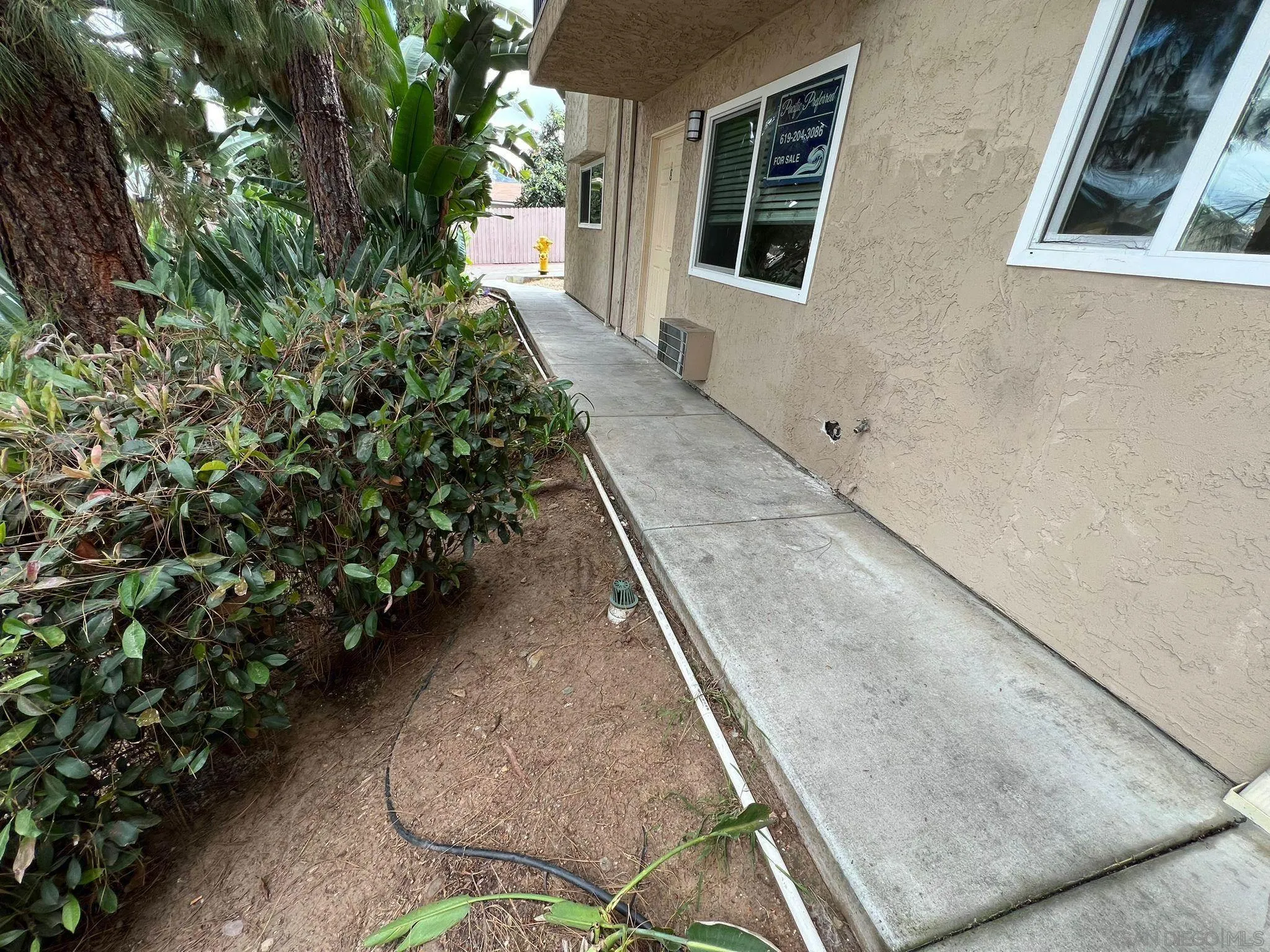 9860 Dale Avenue, Unit D8 Spring Valley, CA 91977 - Photo 15 of 19 a view of a backyard with potted plants