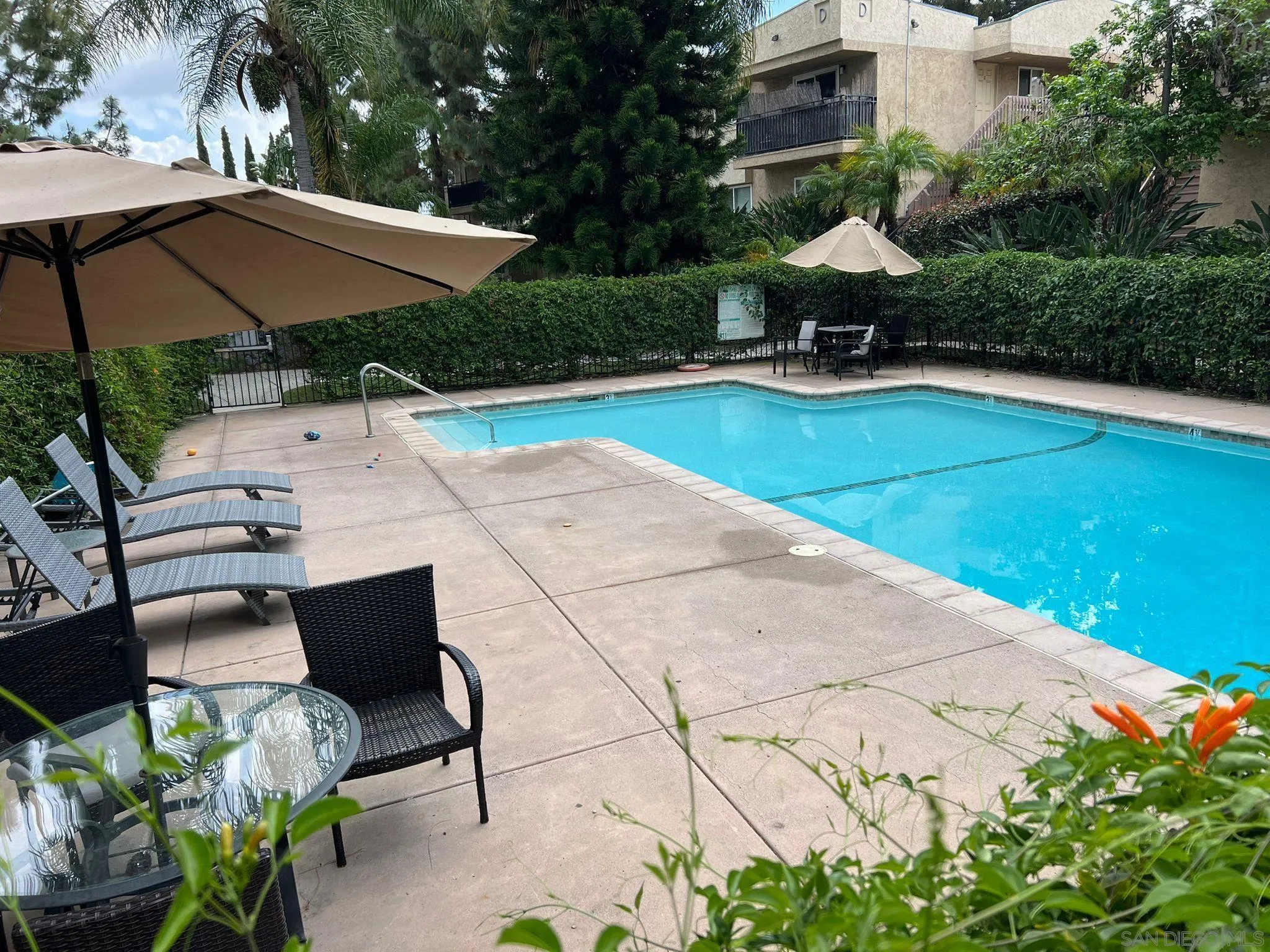 9860 Dale Avenue, Unit D8 Spring Valley, CA 91977 - Photo 19 of 19 a view of backyard with outdoor seating and trees