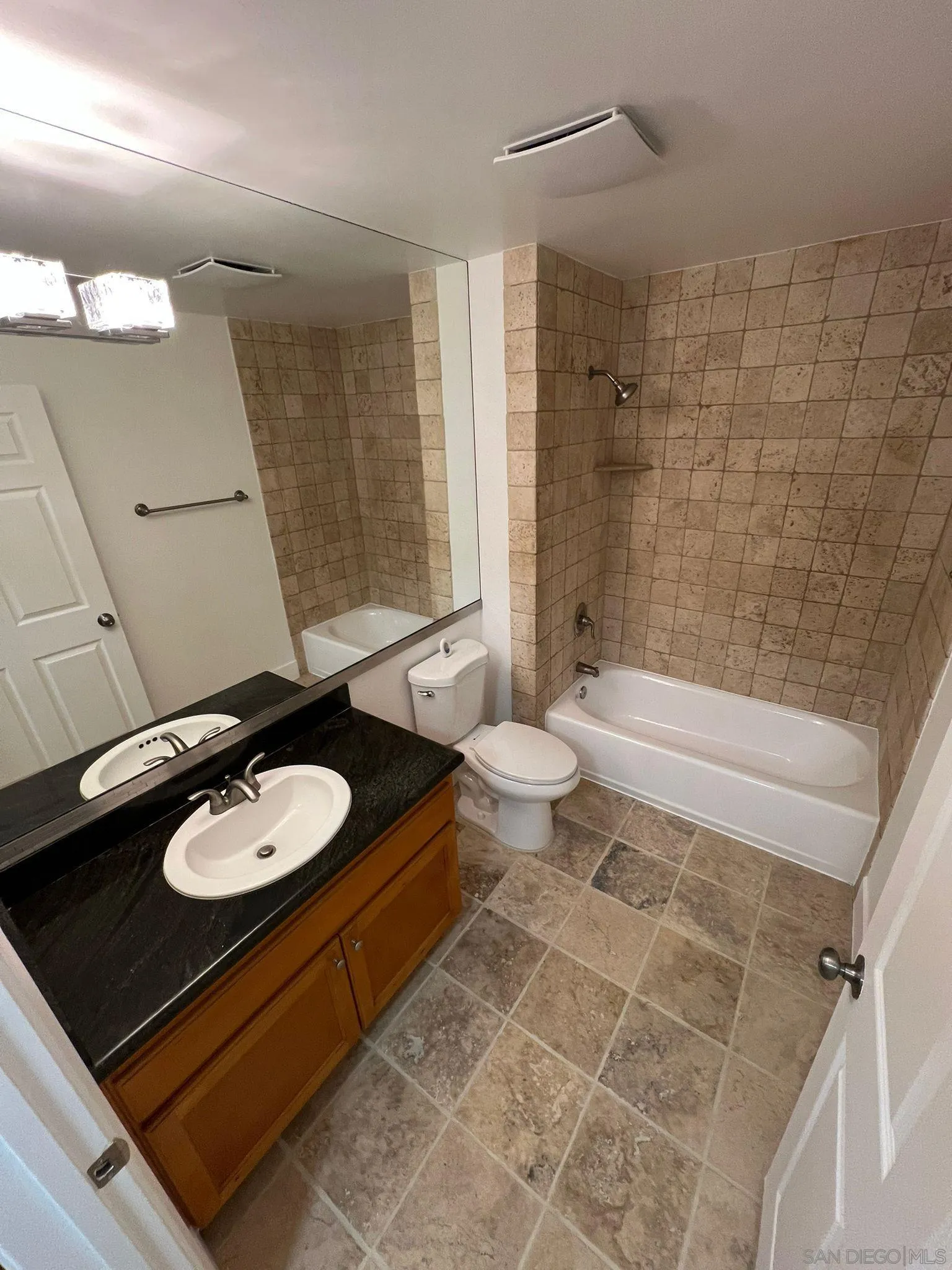 9860 Dale Avenue, Unit D8 Spring Valley, CA 91977 - Photo 10 of 19 a bathroom with a sink a toilet and shower