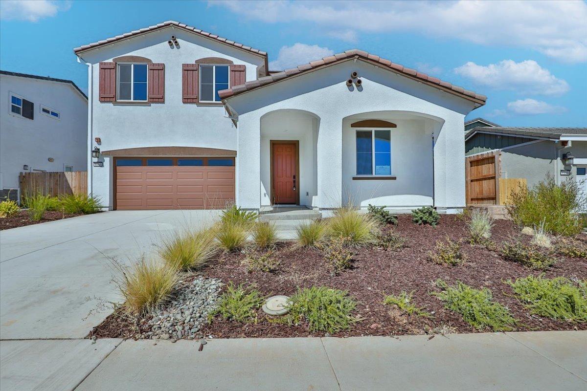 1163 Chapman Street Winters, CA 95694 - Photo 1 of 1 a front view of a house with a yard and garage