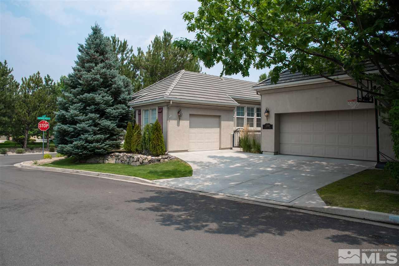 1700 Hunter Creek Road Reno, NV 89519 - Photo 3 of 25 a view of a house with a yard and garage