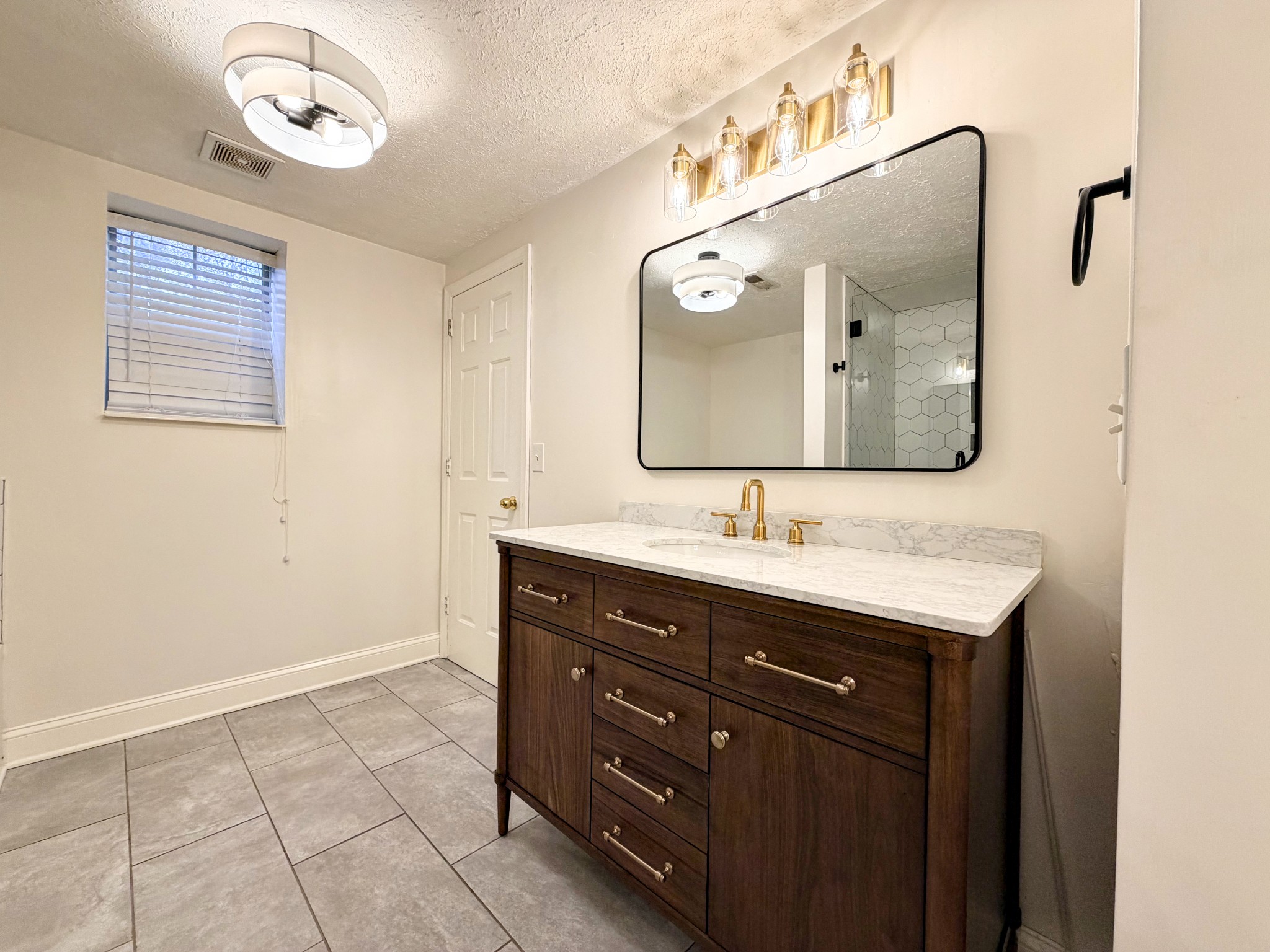 2544 Johnson Ridge Road Antioch, TN 37013 - Photo 22 of 30 a bathroom with a sink and a mirror