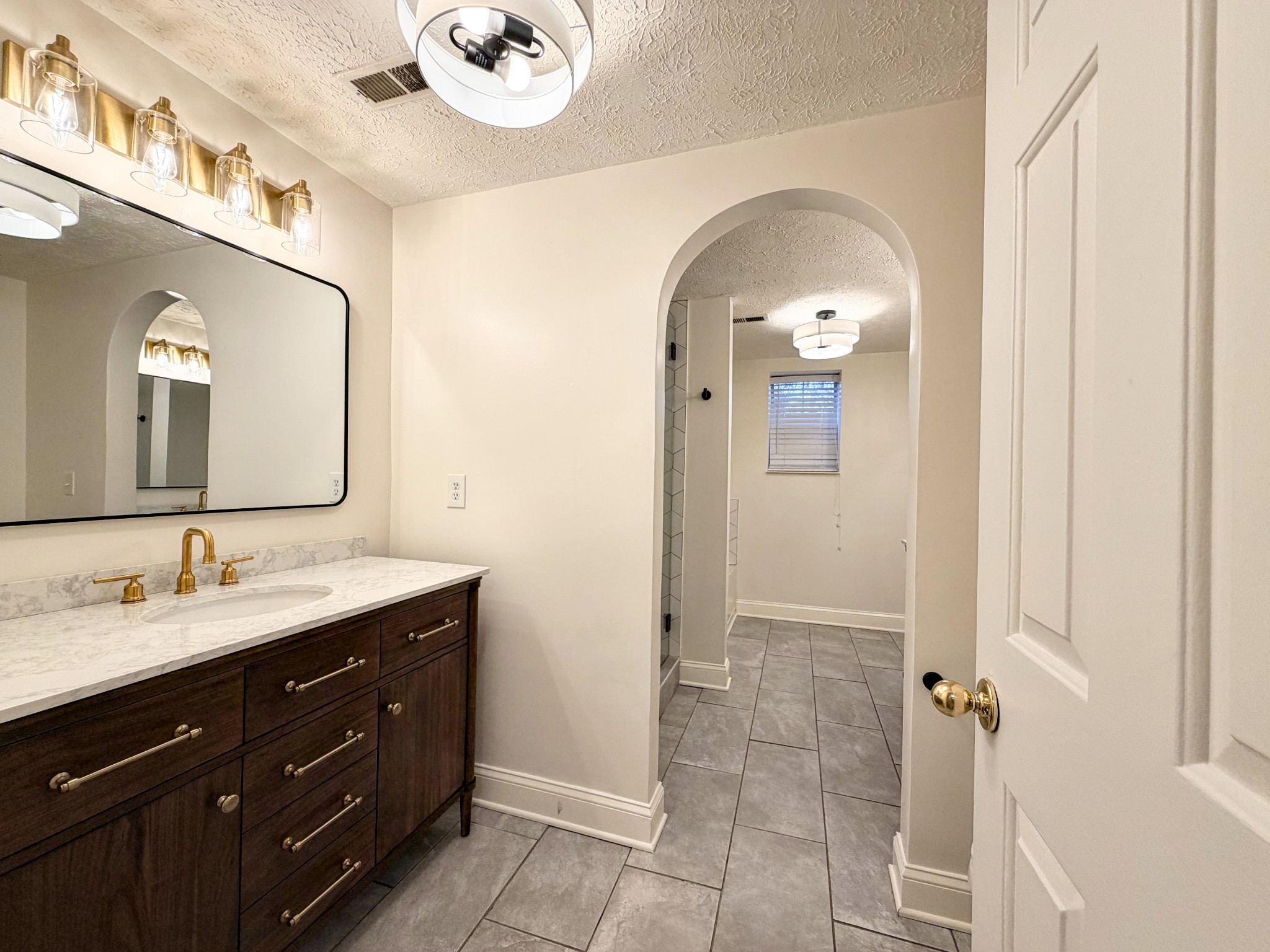 2544 Johnson Ridge Road Antioch, TN 37013 - Photo 23 of 30 a spacious bathroom with a double vanity sink and a mirror