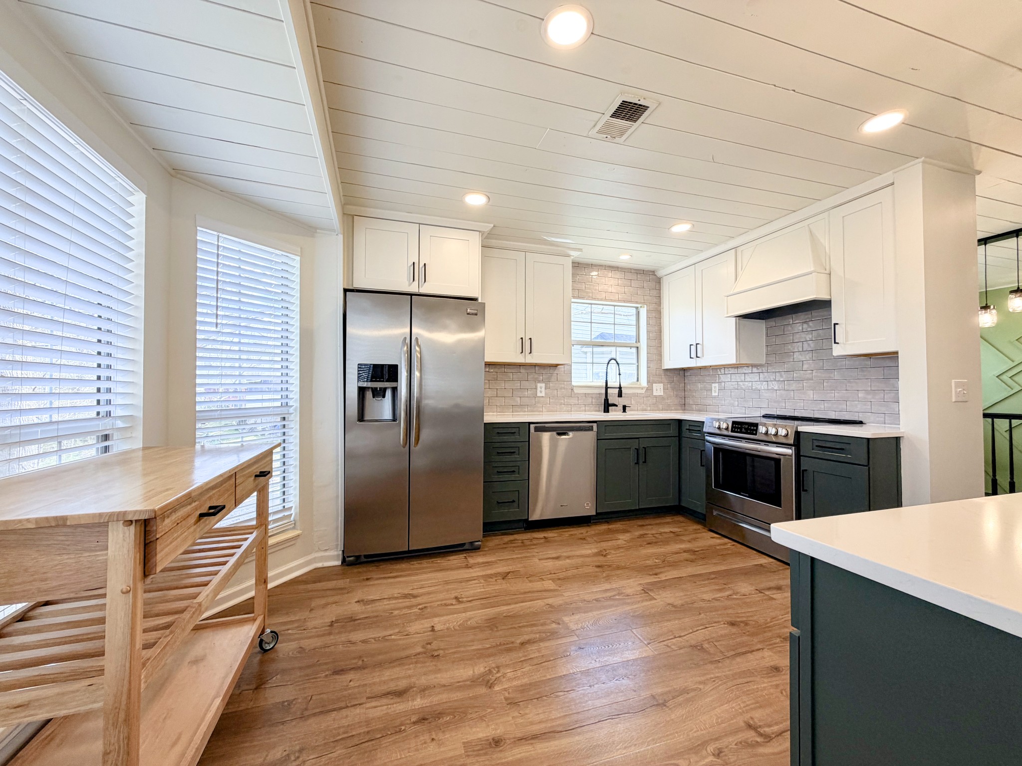2544 Johnson Ridge Road Antioch, TN 37013 - Photo 5 of 30 a kitchen with stainless steel appliances cabinets a sink and a window