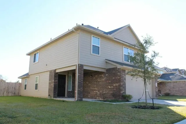 a view of white house with garden