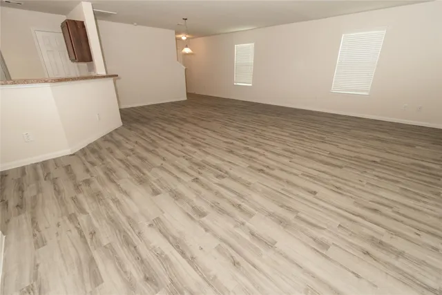 a kitchen with stainless steel appliances granite countertop wooden cabinets a stove top oven a sink and dishwasher