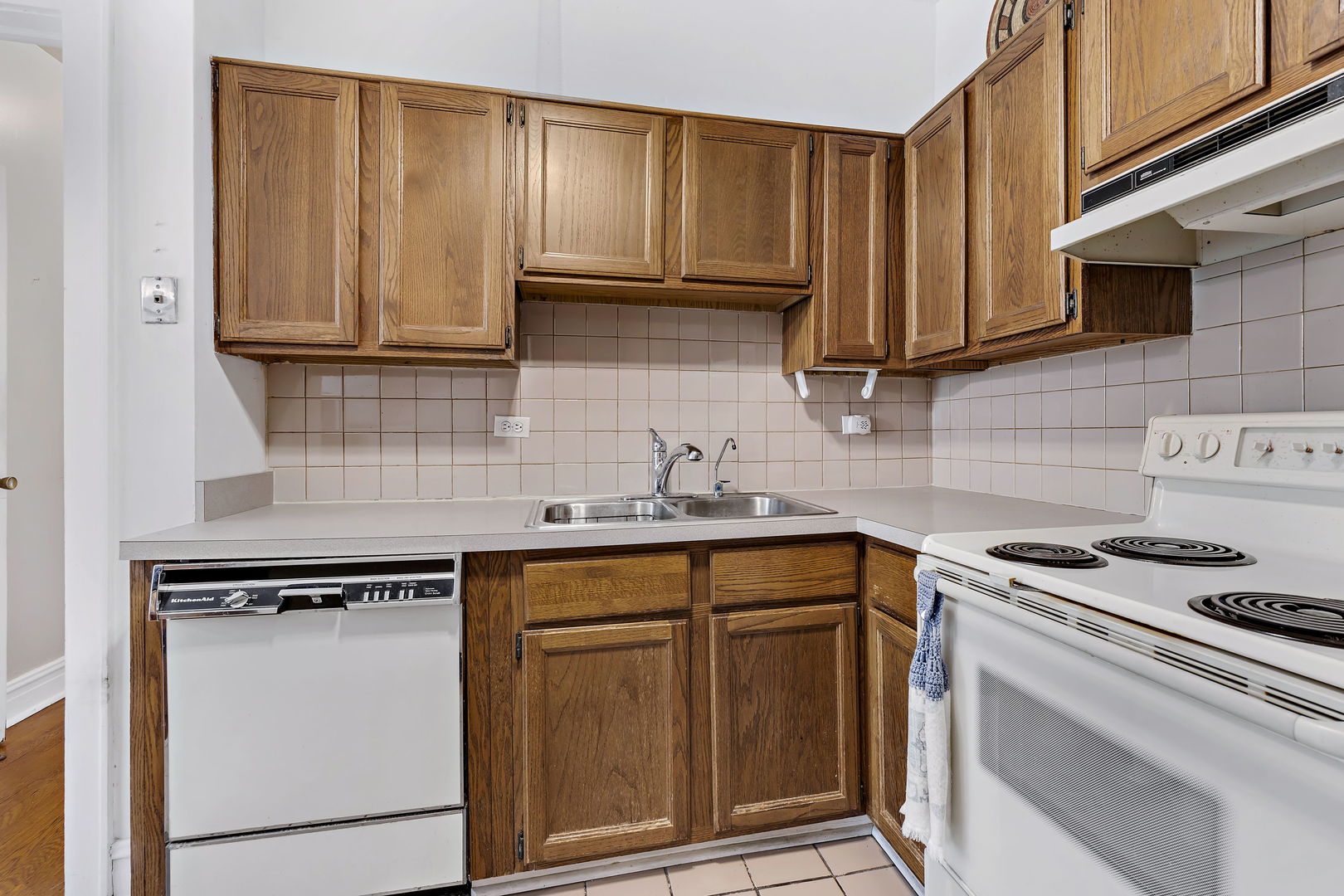 6255 North Sheridan Road, Unit 36 Chicago, IL 60660 - Photo 12 of 25 a kitchen with stainless steel appliances granite countertop a sink stove and cabinets