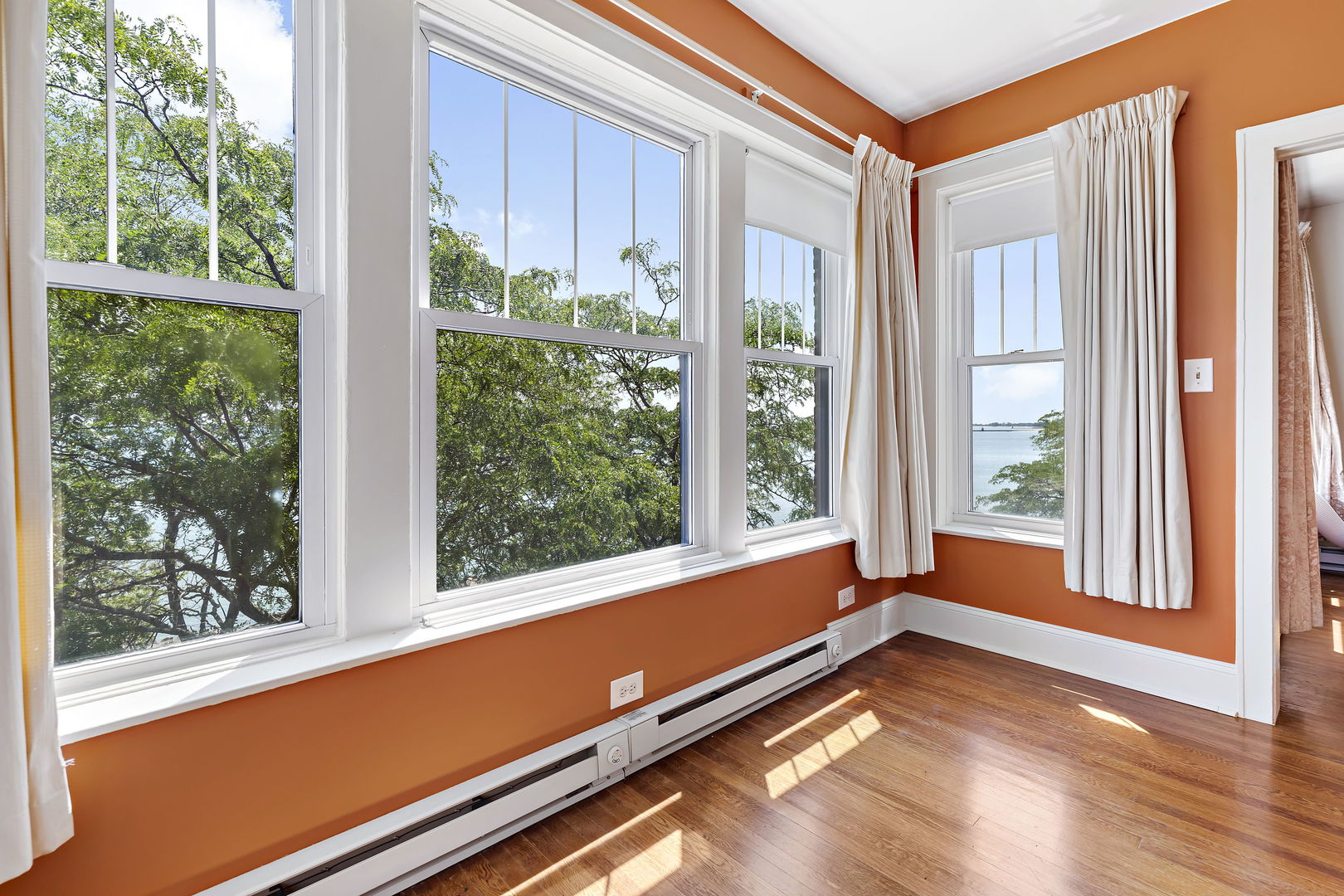 6255 North Sheridan Road, Unit 36 Chicago, IL 60660 - Photo 8 of 25 a view of room with window and wooden floor