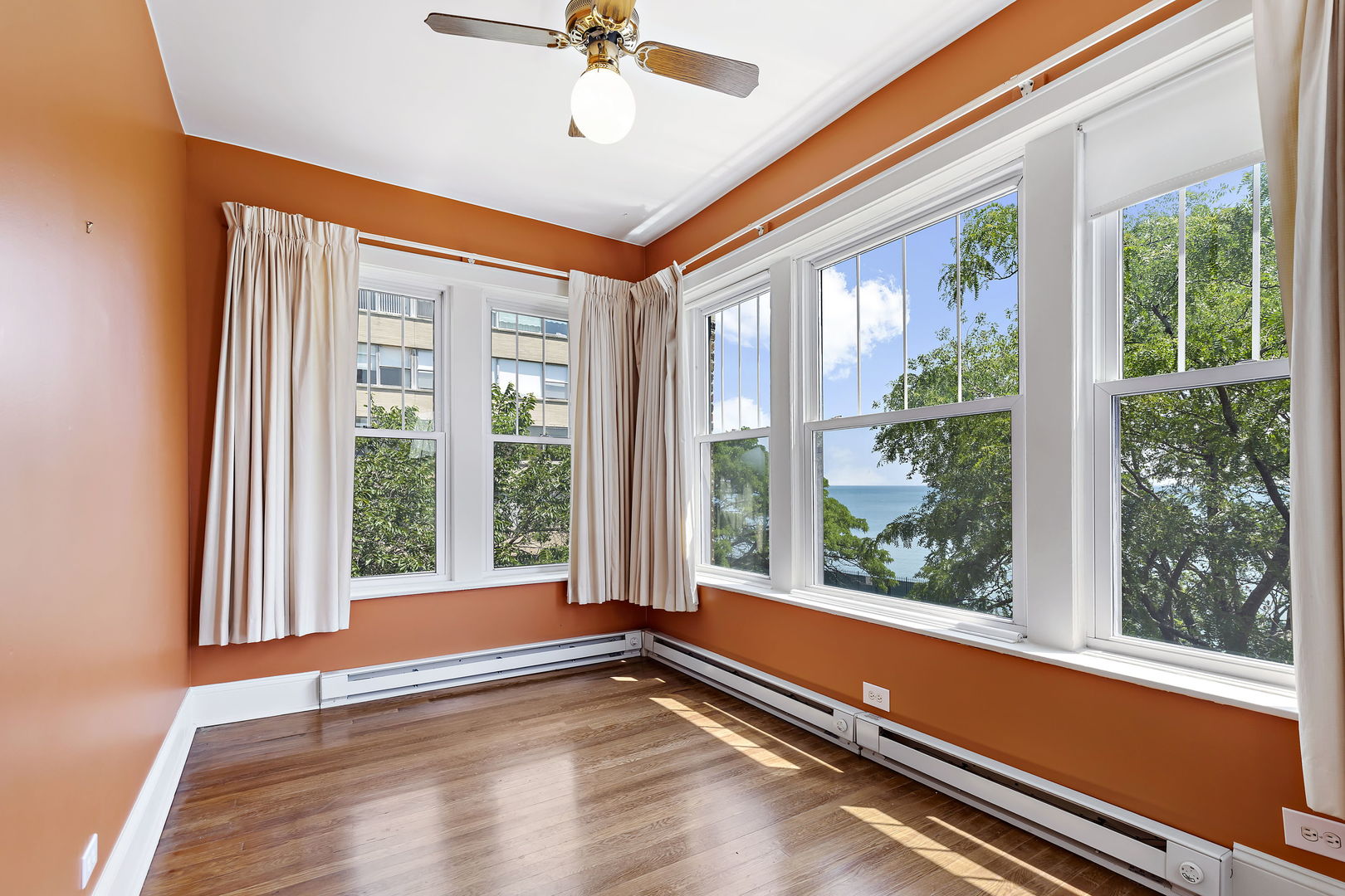 6255 North Sheridan Road, Unit 36 Chicago, IL 60660 - Photo 9 of 25 a view of room with window and wooden floor