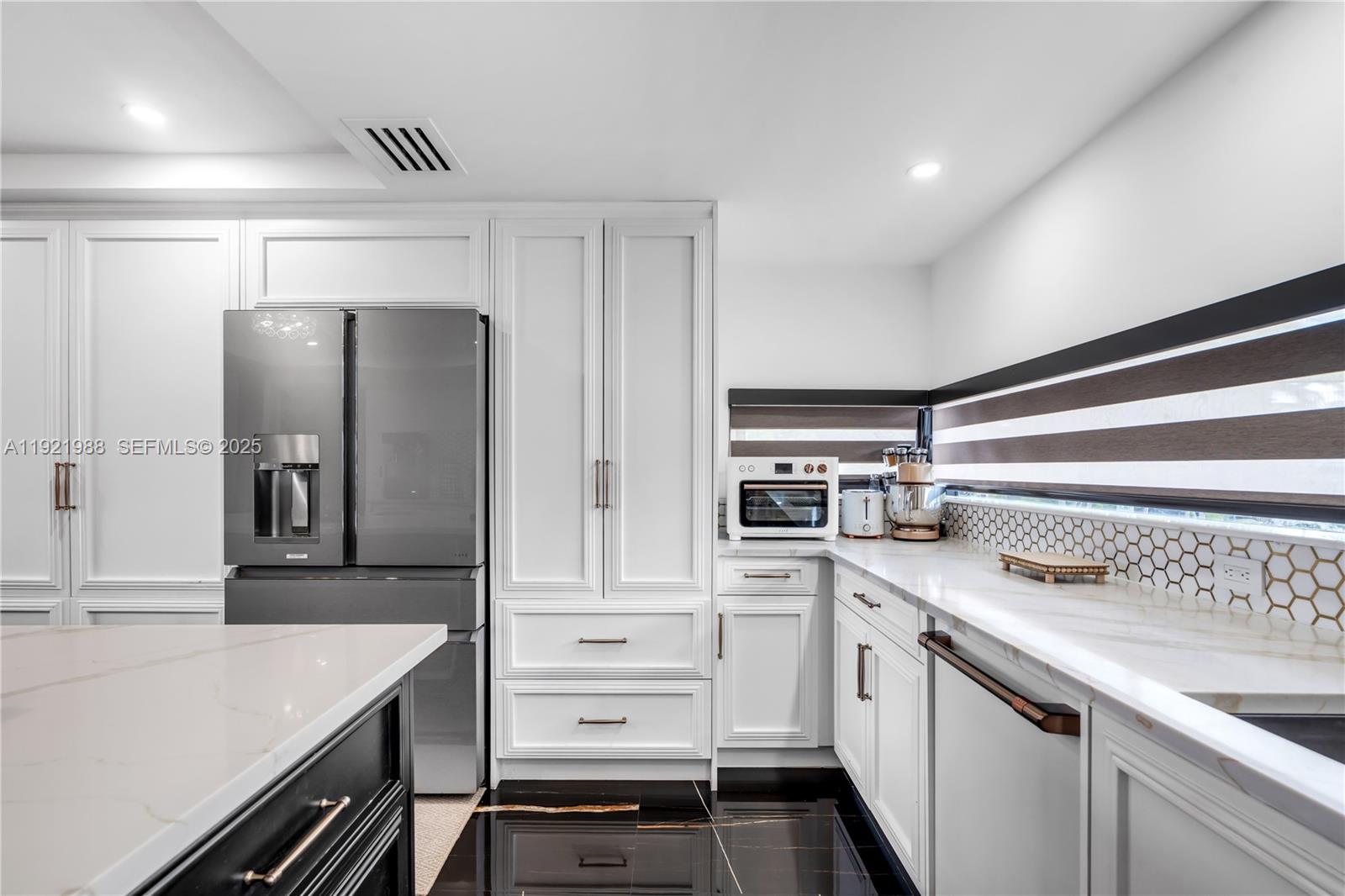 32 North Bounty Lane Key Largo, FL 33037 - Photo 12 of 86 a kitchen with a sink stove and refrigerator