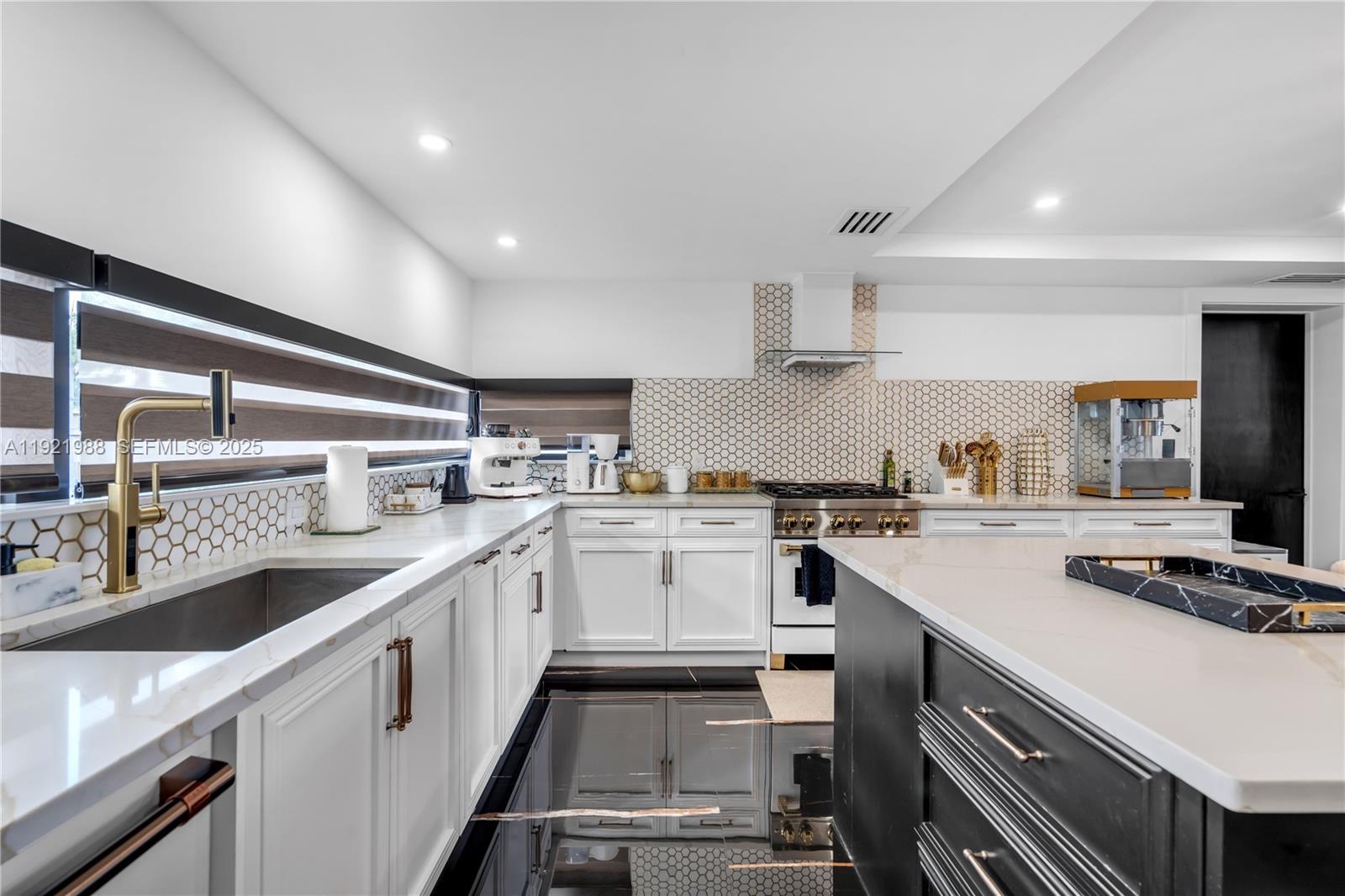 32 North Bounty Lane Key Largo, FL 33037 - Photo 14 of 86 a kitchen with a sink stove and cabinets