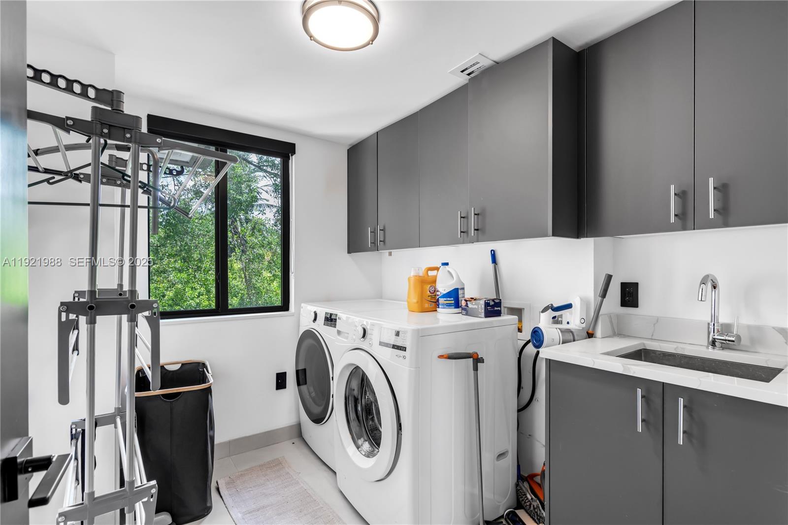 32 North Bounty Lane Key Largo, FL 33037 - Photo 16 of 86 a utility room with sink dryer and washer