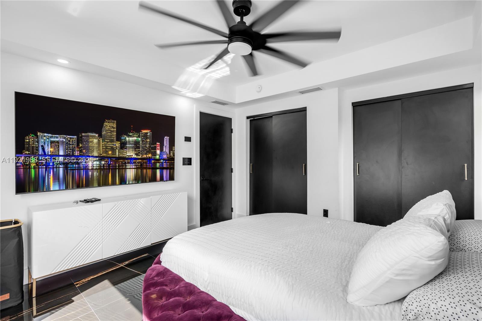 32 North Bounty Lane Key Largo, FL 33037 - Photo 28 of 86 a bedroom with a large bed and a bookshelf