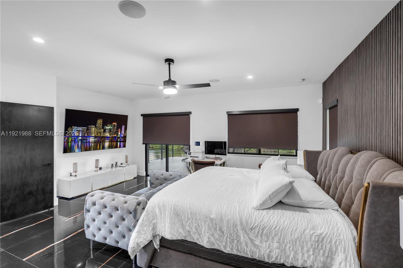 32 North Bounty Lane Key Largo, FL 33037 - Photo 30 of 86 a bedroom with a bed a couch and a flat screen tv