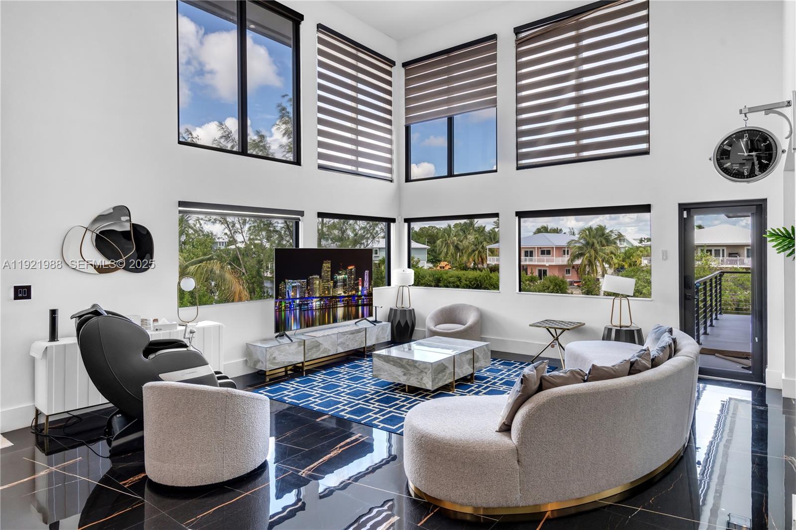 32 North Bounty Lane Key Largo, FL 33037 - Photo 3 of 86 a living room with furniture and a floor to ceiling window