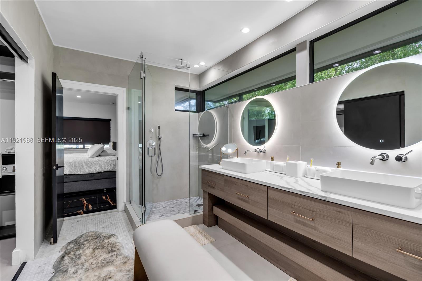 32 North Bounty Lane Key Largo, FL 33037 - Photo 33 of 86 a en suite bathroom with a double vanity sink and a mirror