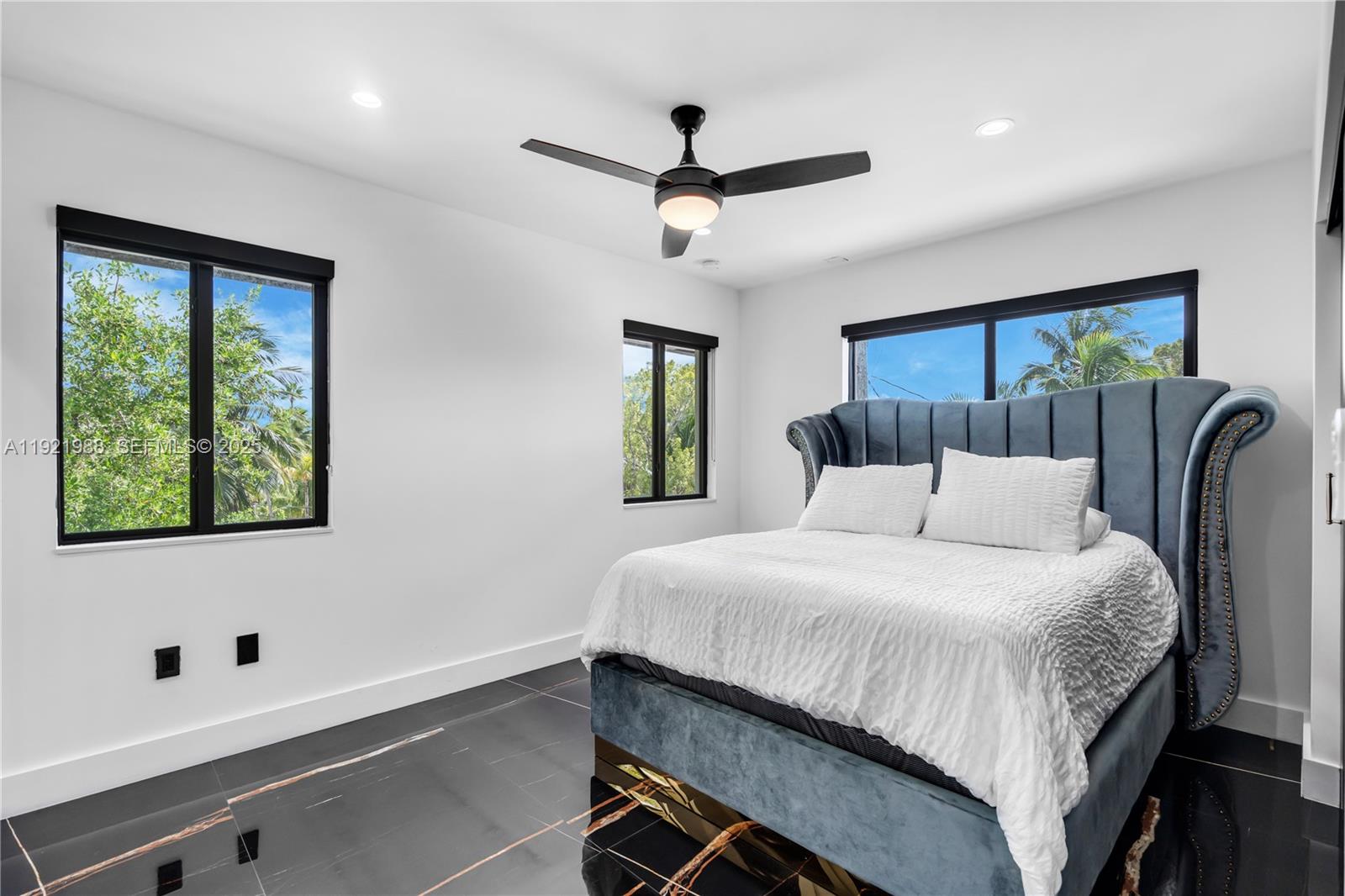 32 North Bounty Lane Key Largo, FL 33037 - Photo 37 of 86 a bedroom with a bed and a window