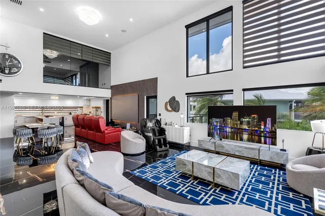 a living room with lots of furniture and wooden floor