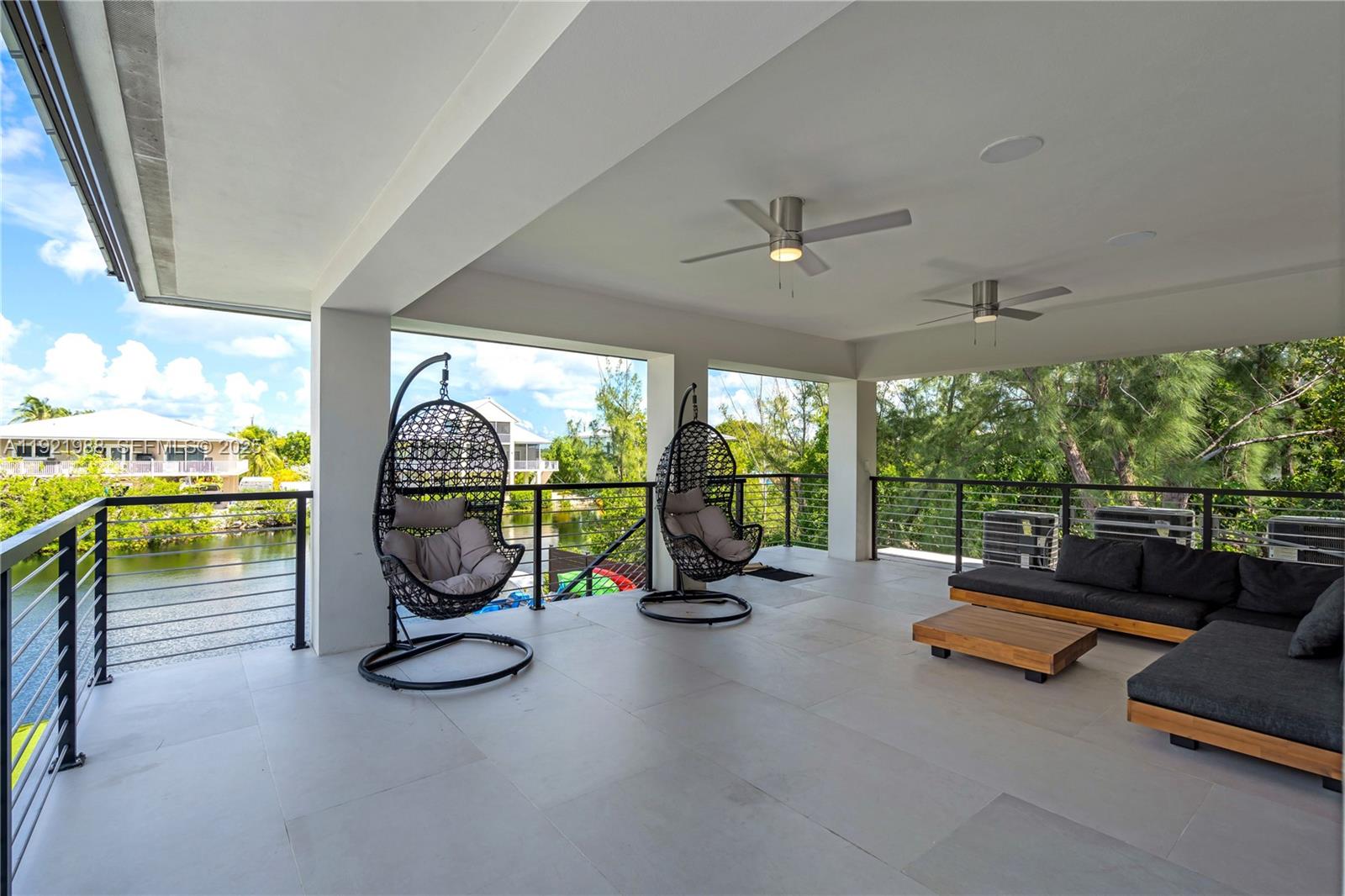 32 North Bounty Lane Key Largo, FL 33037 - Photo 48 of 86 a view of a room with gym equipment and a large window