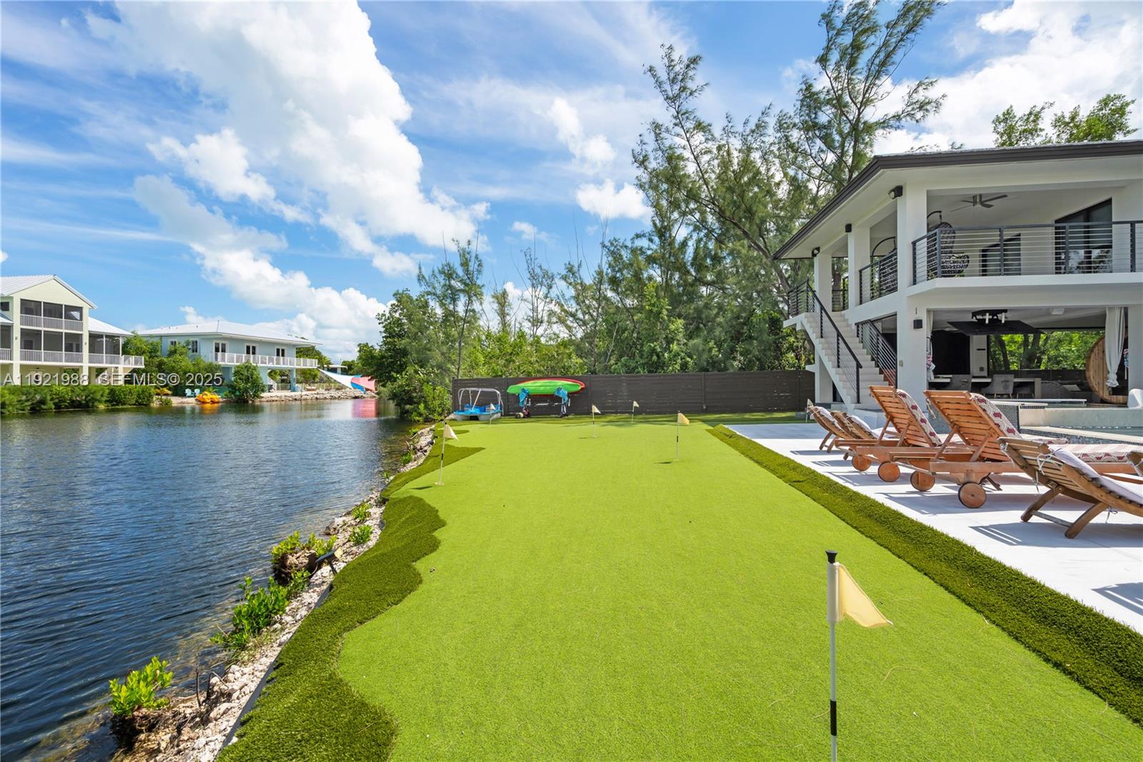 32 North Bounty Lane Key Largo, FL 33037 - Photo 60 of 86 a view of a lake with a house in the background