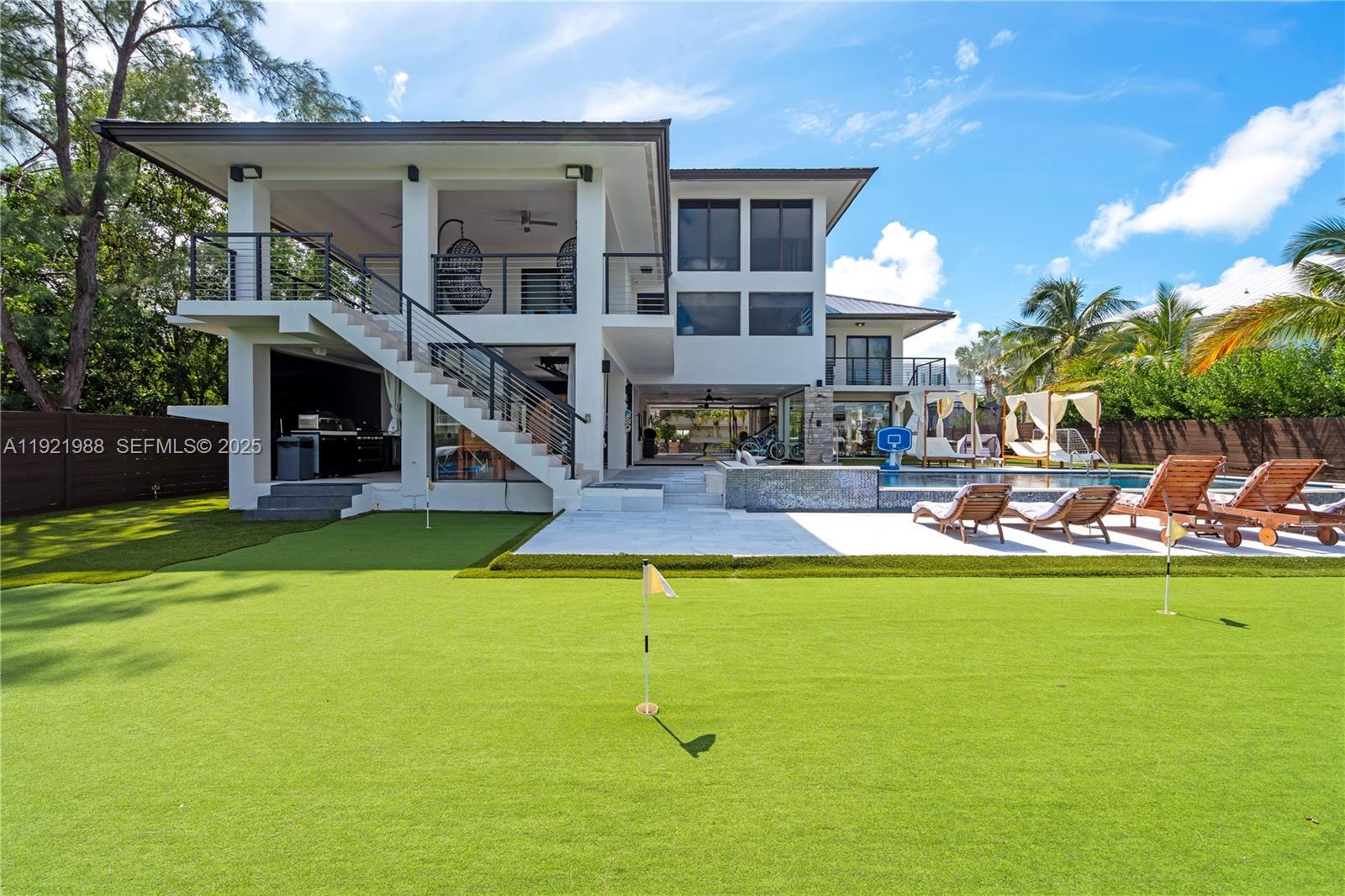 32 North Bounty Lane Key Largo, FL 33037 - Photo 62 of 86 a view of a house with swimming pool and yard