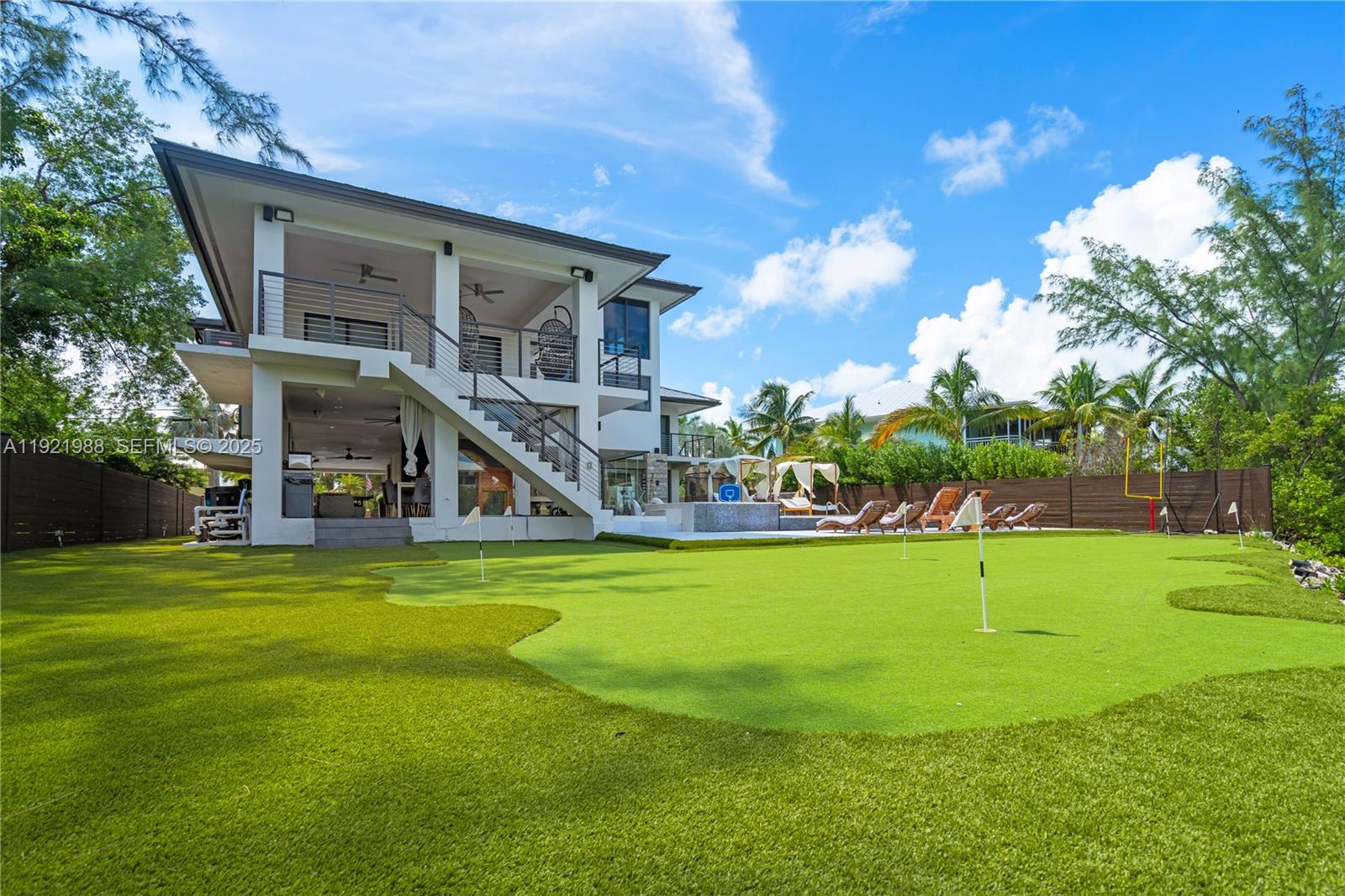 32 North Bounty Lane Key Largo, FL 33037 - Photo 65 of 86 a front view of a house with swimming pool having outdoor seating