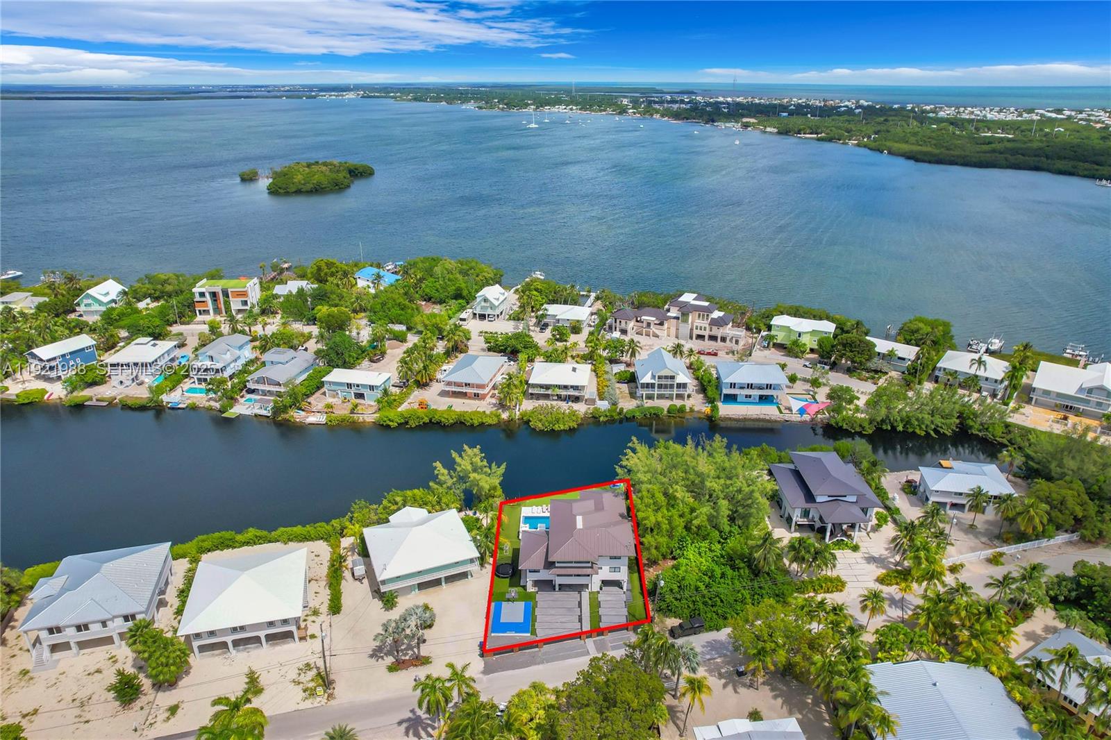 32 North Bounty Lane Key Largo, FL 33037 - Photo 80 of 86 an aerial view of a house with a lake view