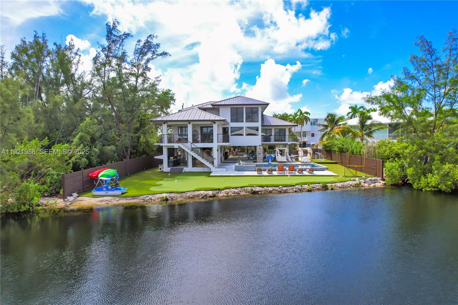 32 North Bounty Lane Key Largo, FL 33037 - Photo 86 of 86 an aerial view of a house with swimming pool patio and lake view