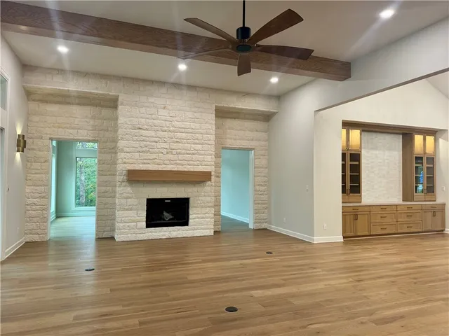 a bathroom with a toilet a sink a tub and mirror