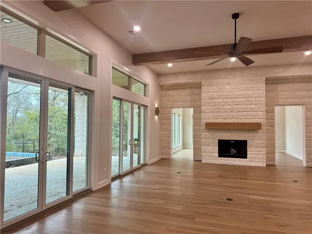 a bathroom with a granite countertop sink mirror and shower