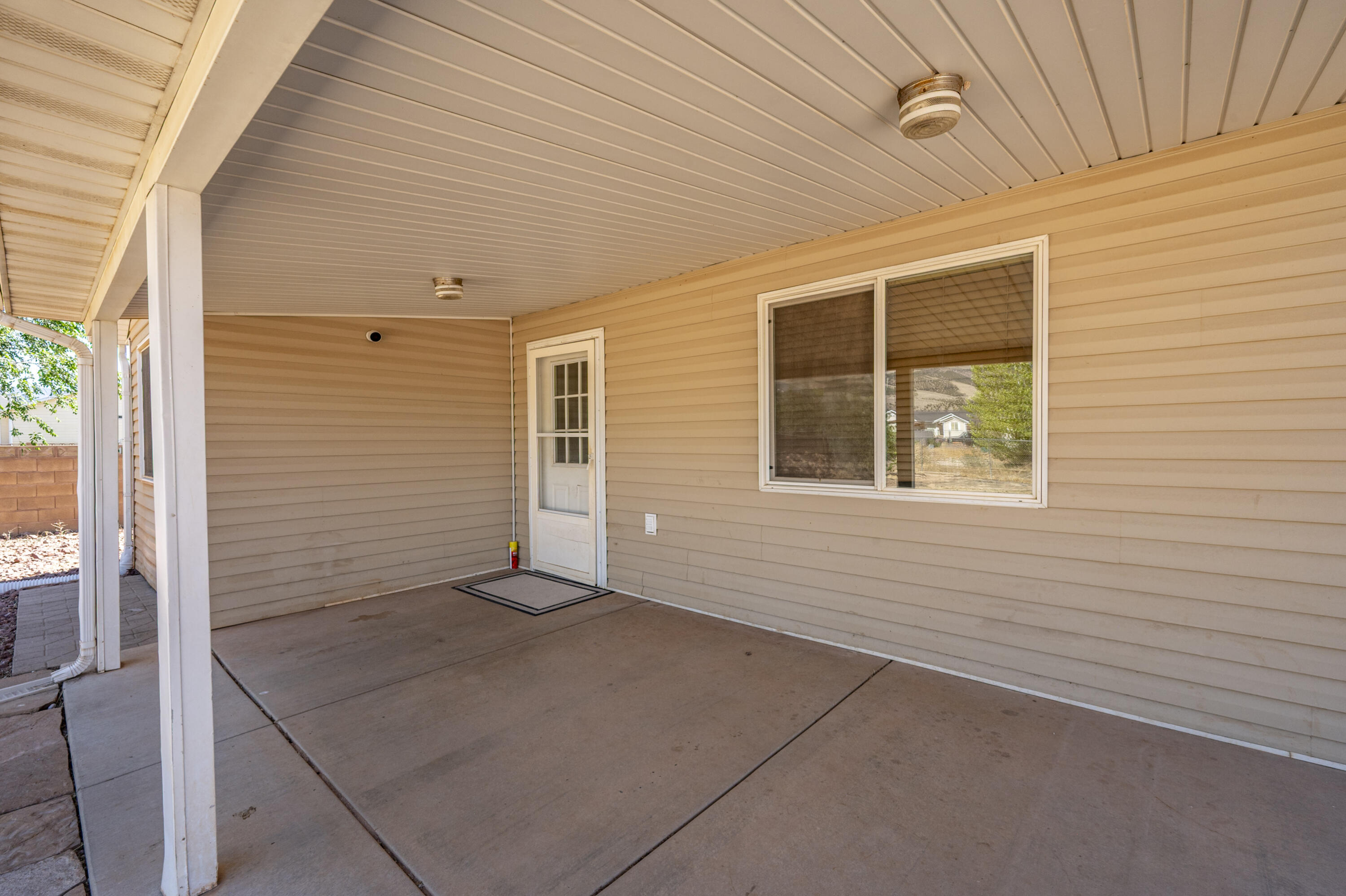 4510 North Half Mile Road Cedar City, UT 84721 - Photo 31 of 48 Extend your living space to the large covered rear patio.