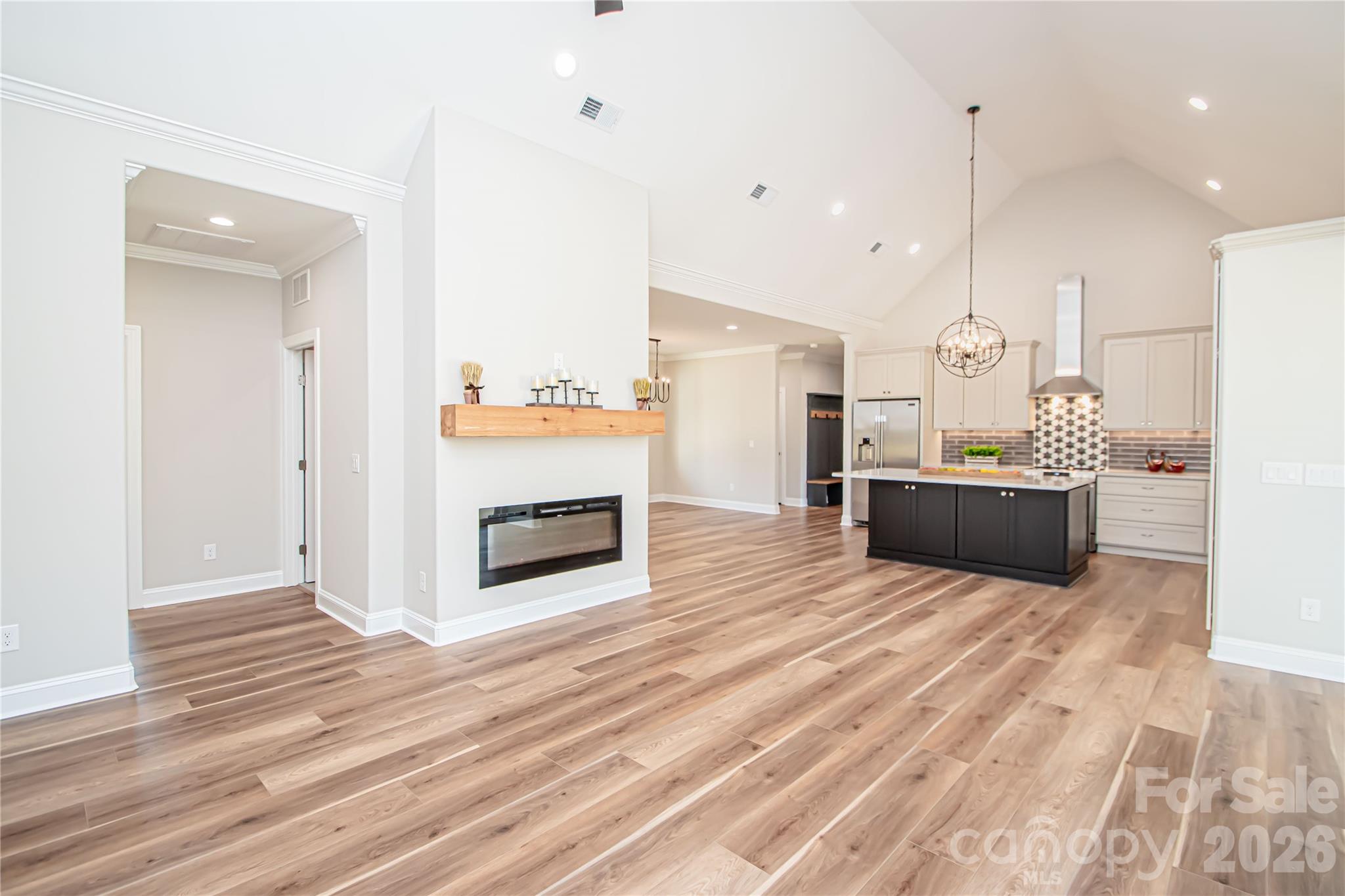 1508 Marion Street Monroe, NC 28112 - Photo 12 of 48 a view of a kitchen with kitchen island wooden floor center island and stainless steel appliances