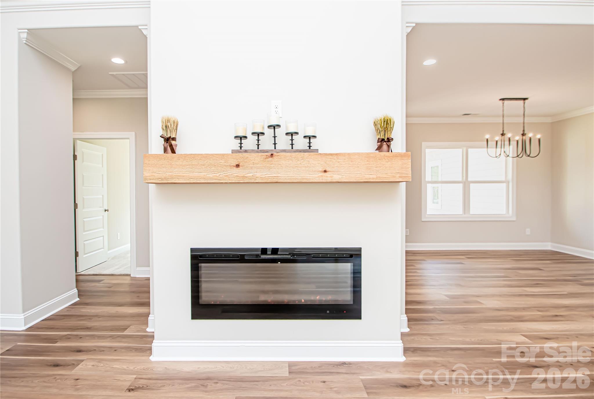1508 Marion Street Monroe, NC 28112 - Photo 14 of 48 a kitchen with a wooden floor and a fireplace