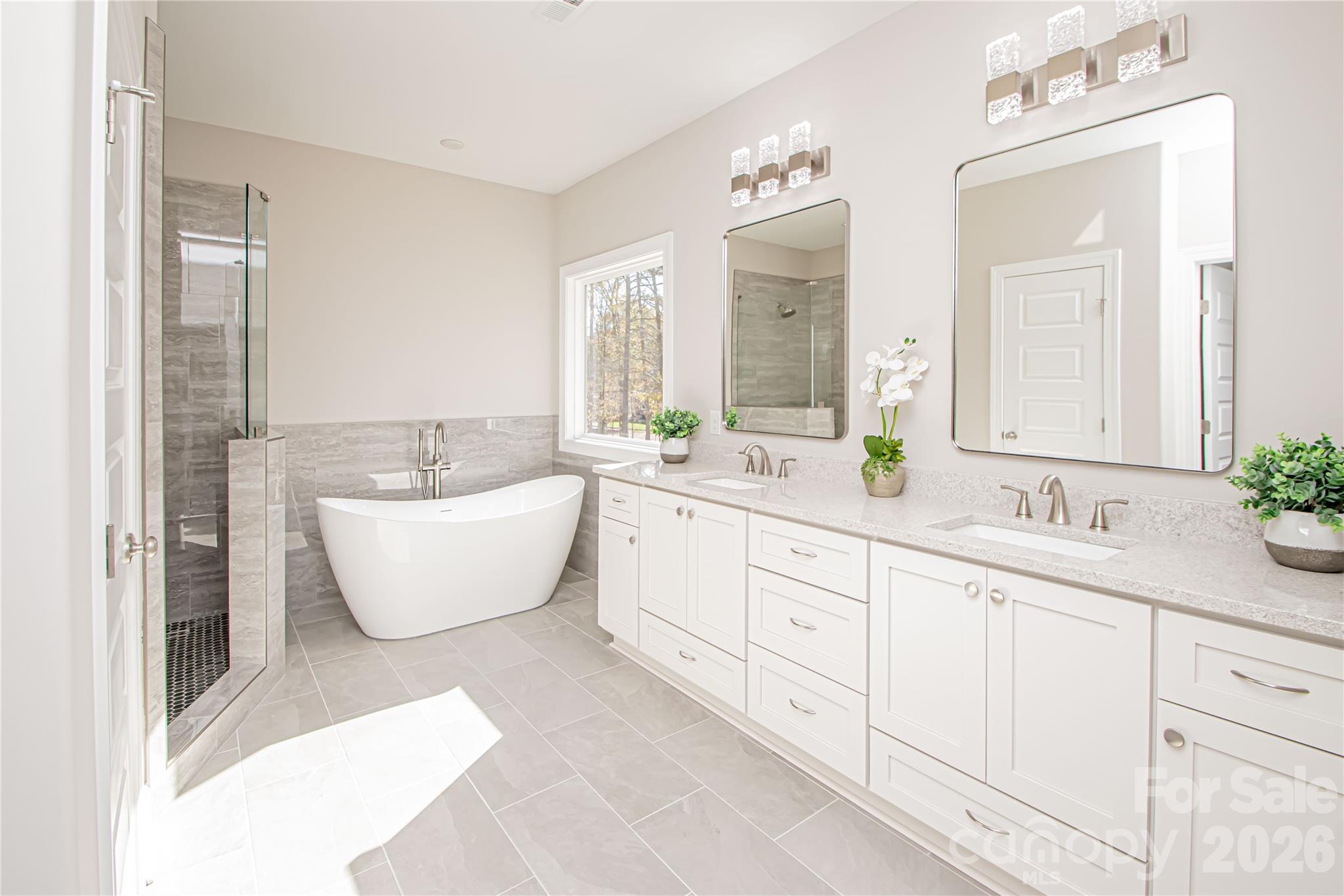 1508 Marion Street Monroe, NC 28112 - Photo 19 of 48 a spacious bathroom with double sink and a bathtub