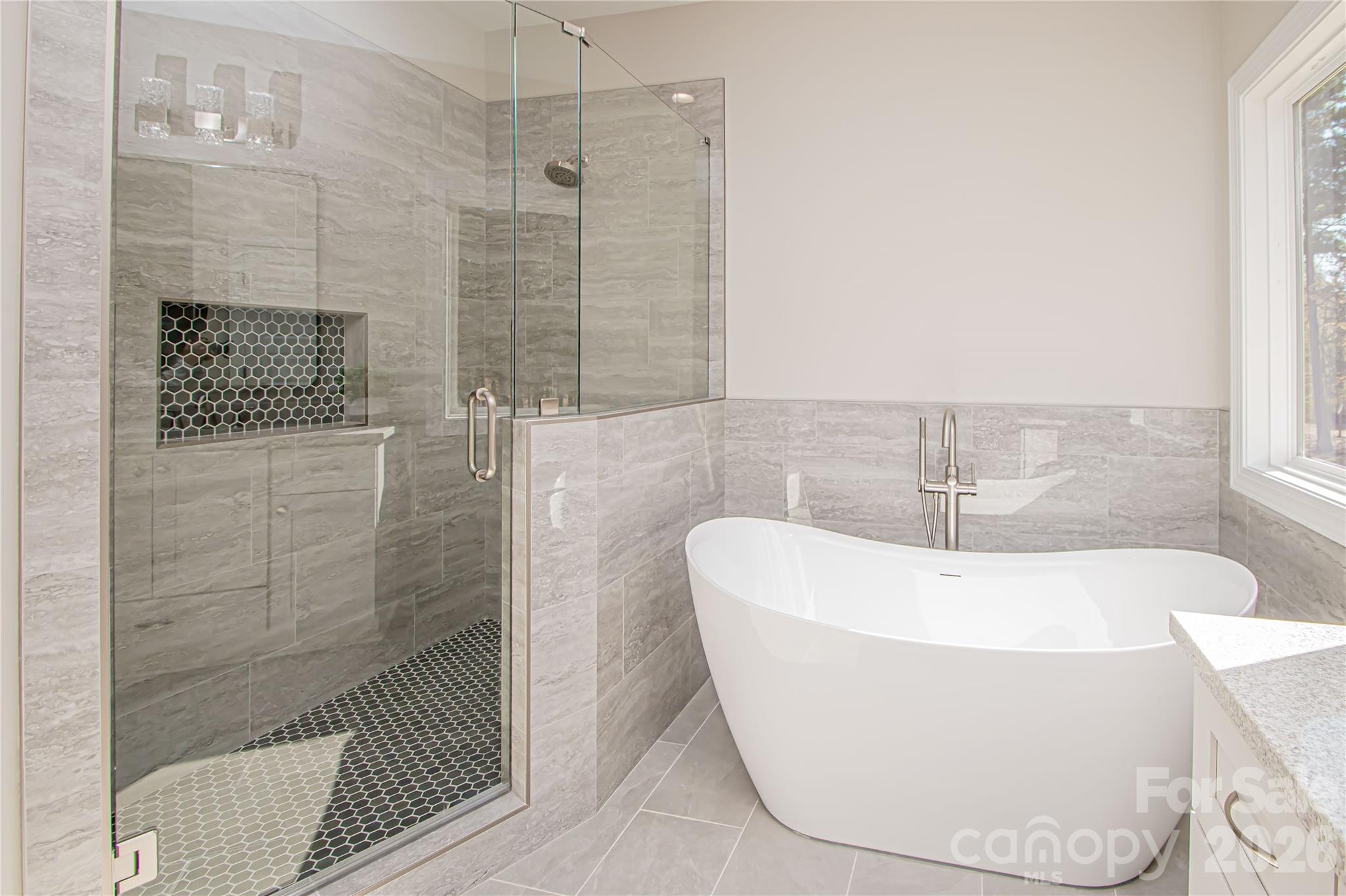1508 Marion Street Monroe, NC 28112 - Photo 20 of 48 a white bath tub sitting in a bathroom and shower