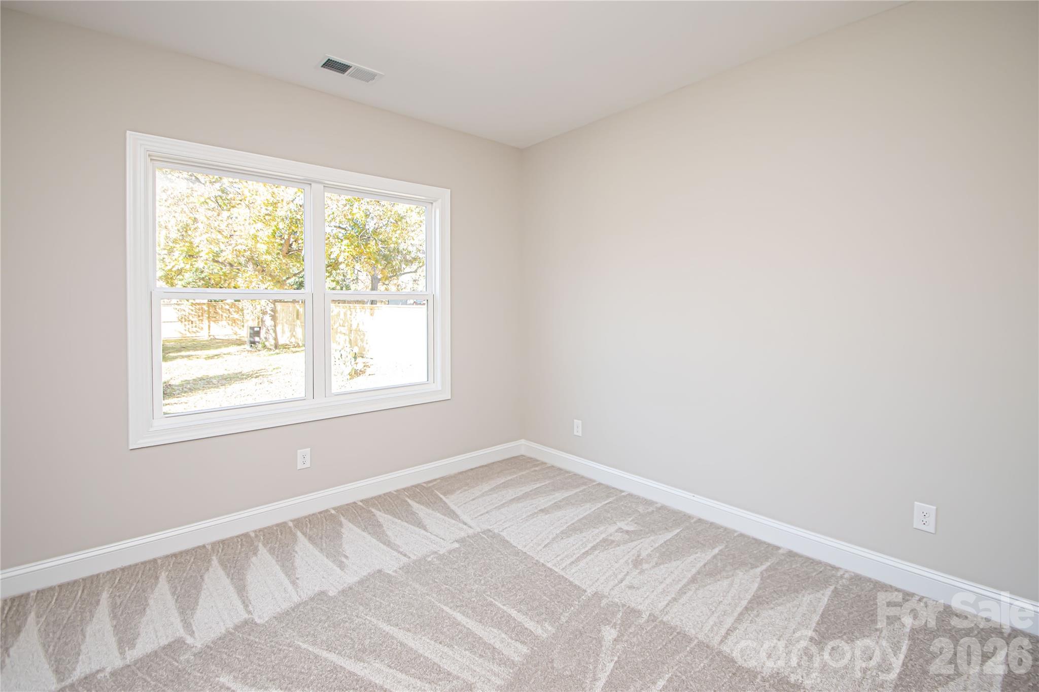1508 Marion Street Monroe, NC 28112 - Photo 28 of 48 a view of an empty room with a window