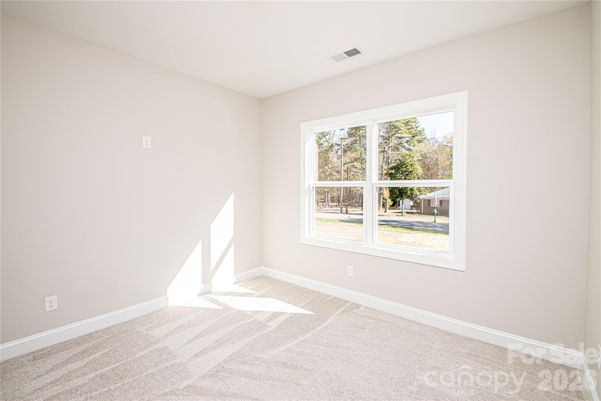1508 Marion Street Monroe, NC 28112 - Photo 30 of 48 an empty room with wooden floor and windows