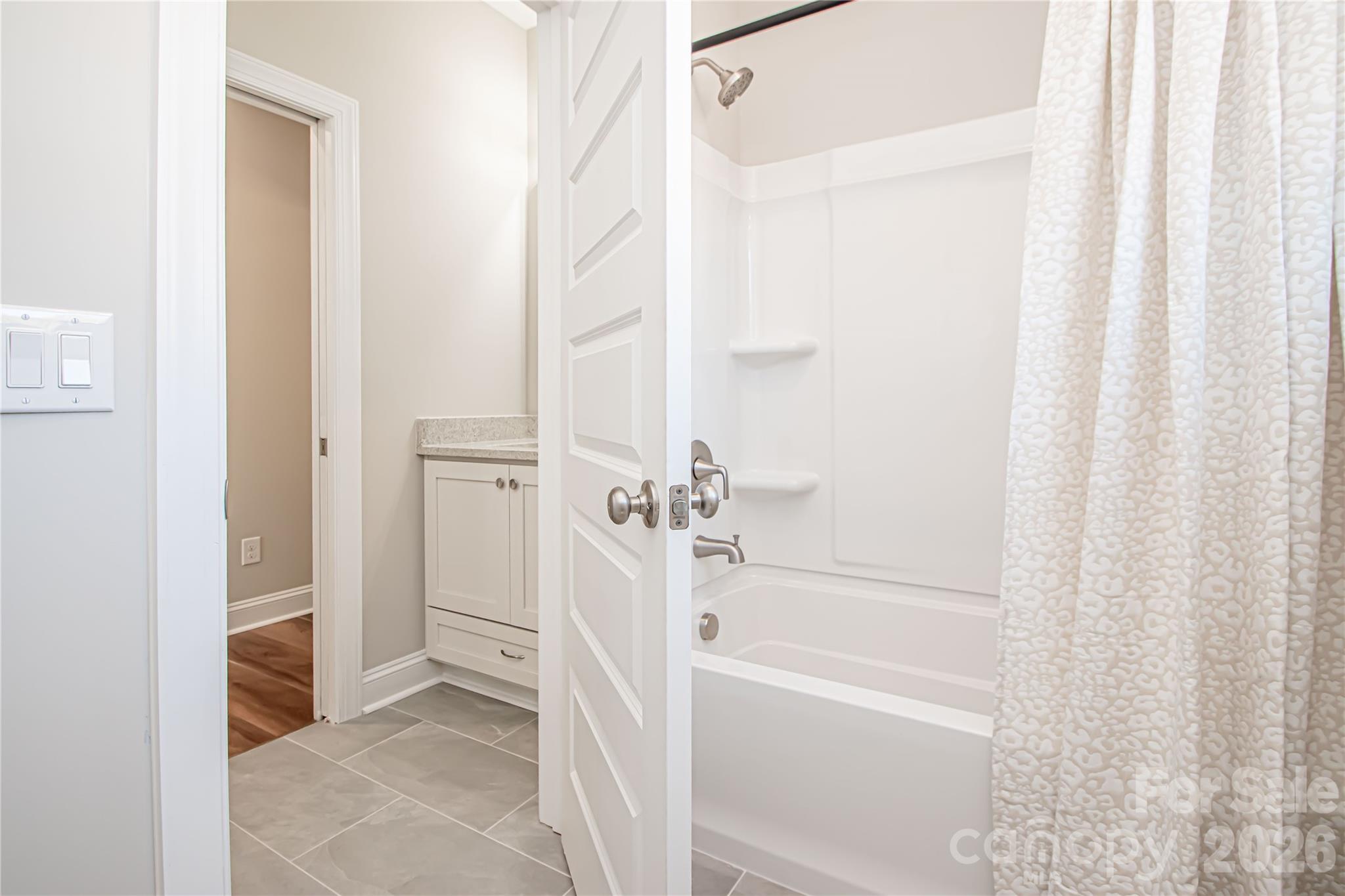 1508 Marion Street Monroe, NC 28112 - Photo 35 of 48 a bathroom with a bathtub and a shower
